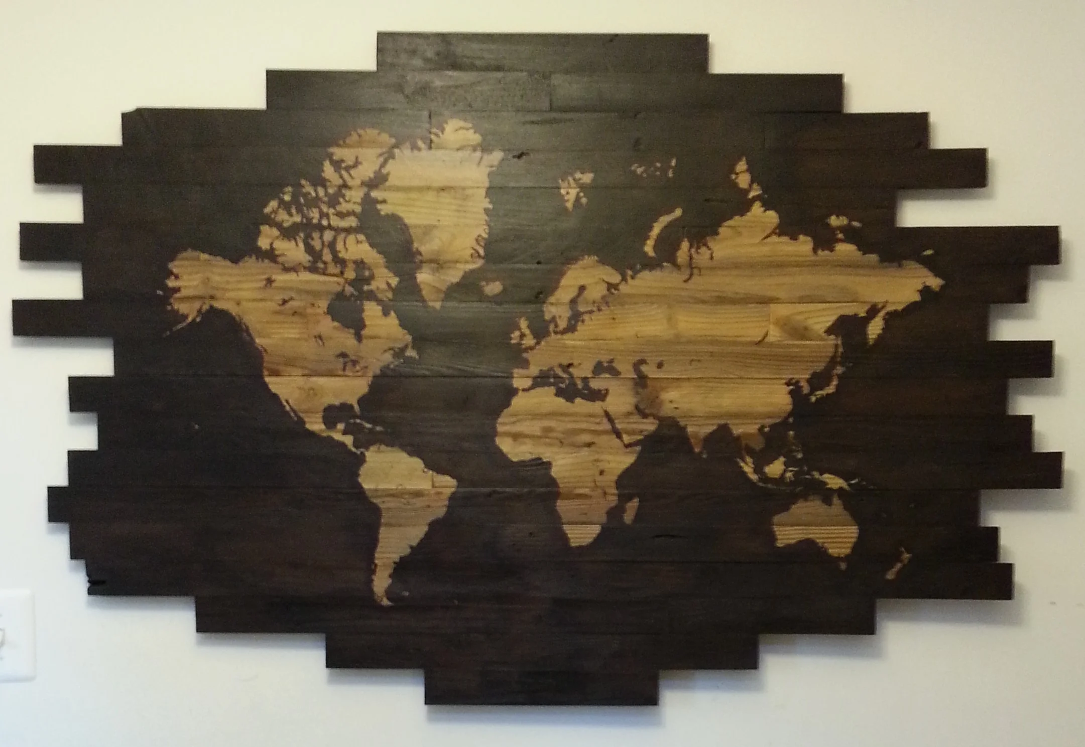   56 1/4" w x 35 1/2" h. light continents against dark gel wood stain water on reclaimed wood.&nbsp;  