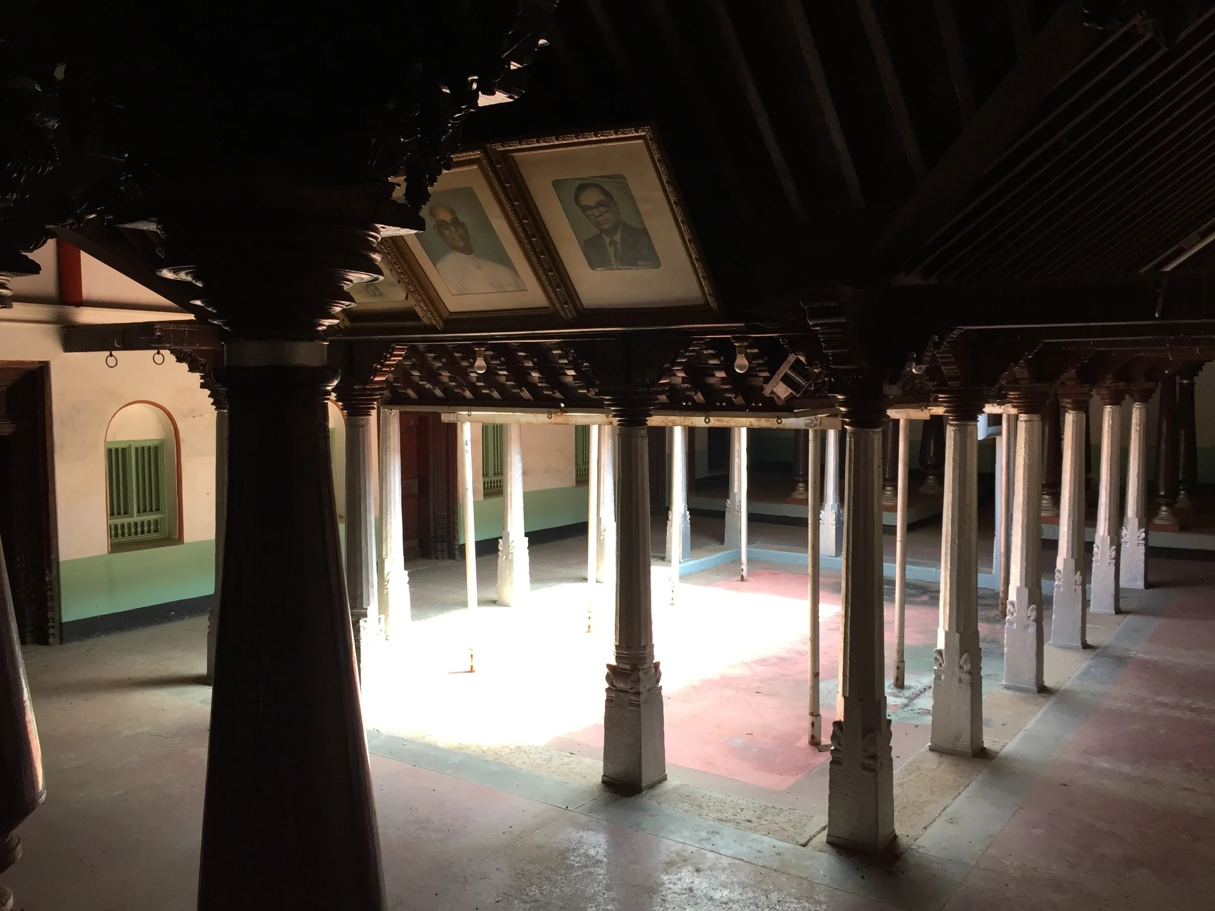 My great grandfather and grandfather's pictures hang at the entrance to the main courtyard used primarily for wedding celebrations. © Rena Thiagarajan 