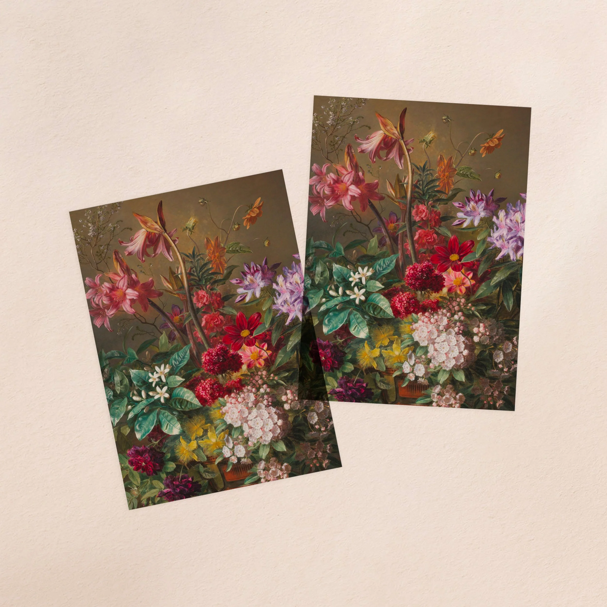 Two vellum paper overlay sheets with a printed moody floral arrangement design