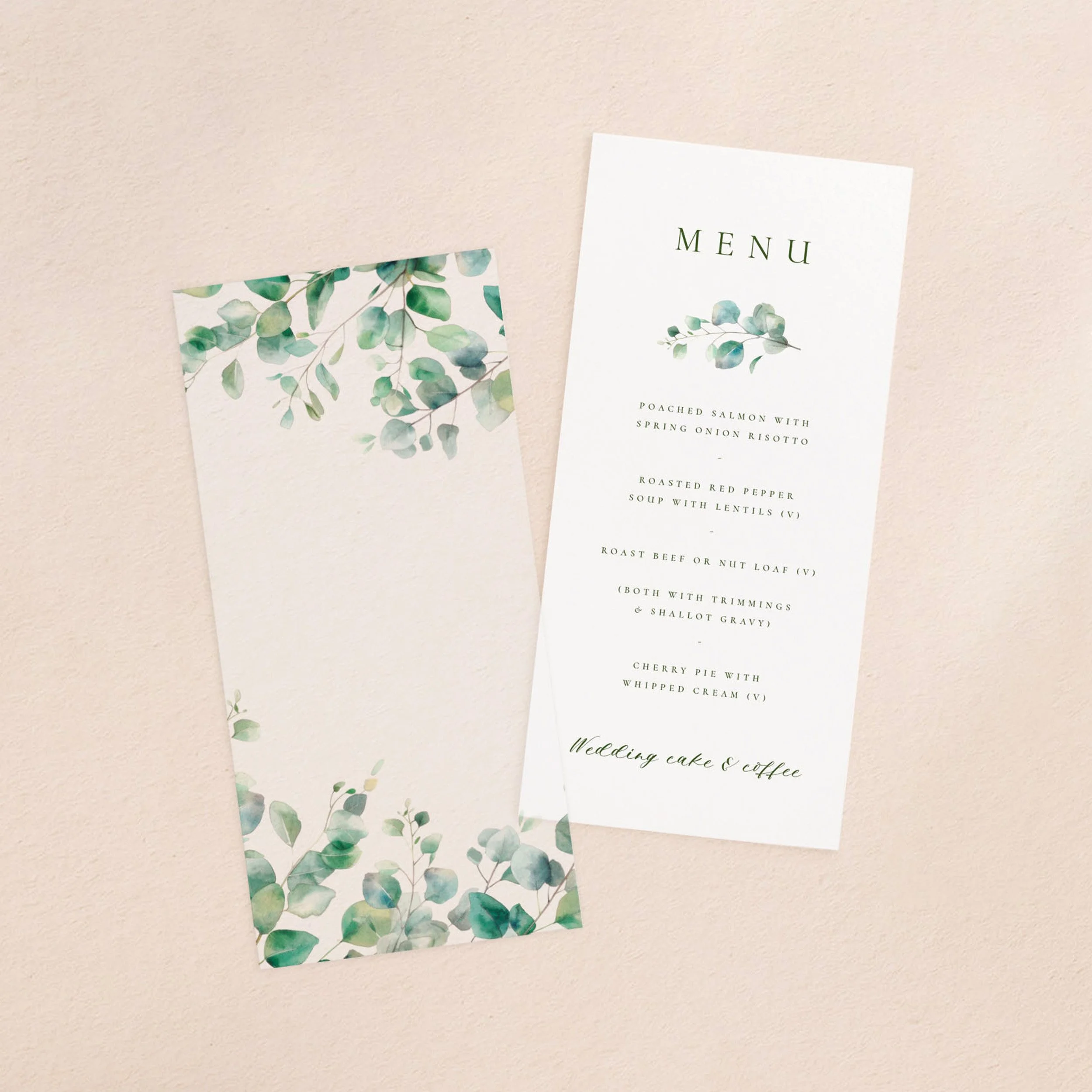 A wedding menu card and vellum paper overlay sheet with a eucalyptus leaf design