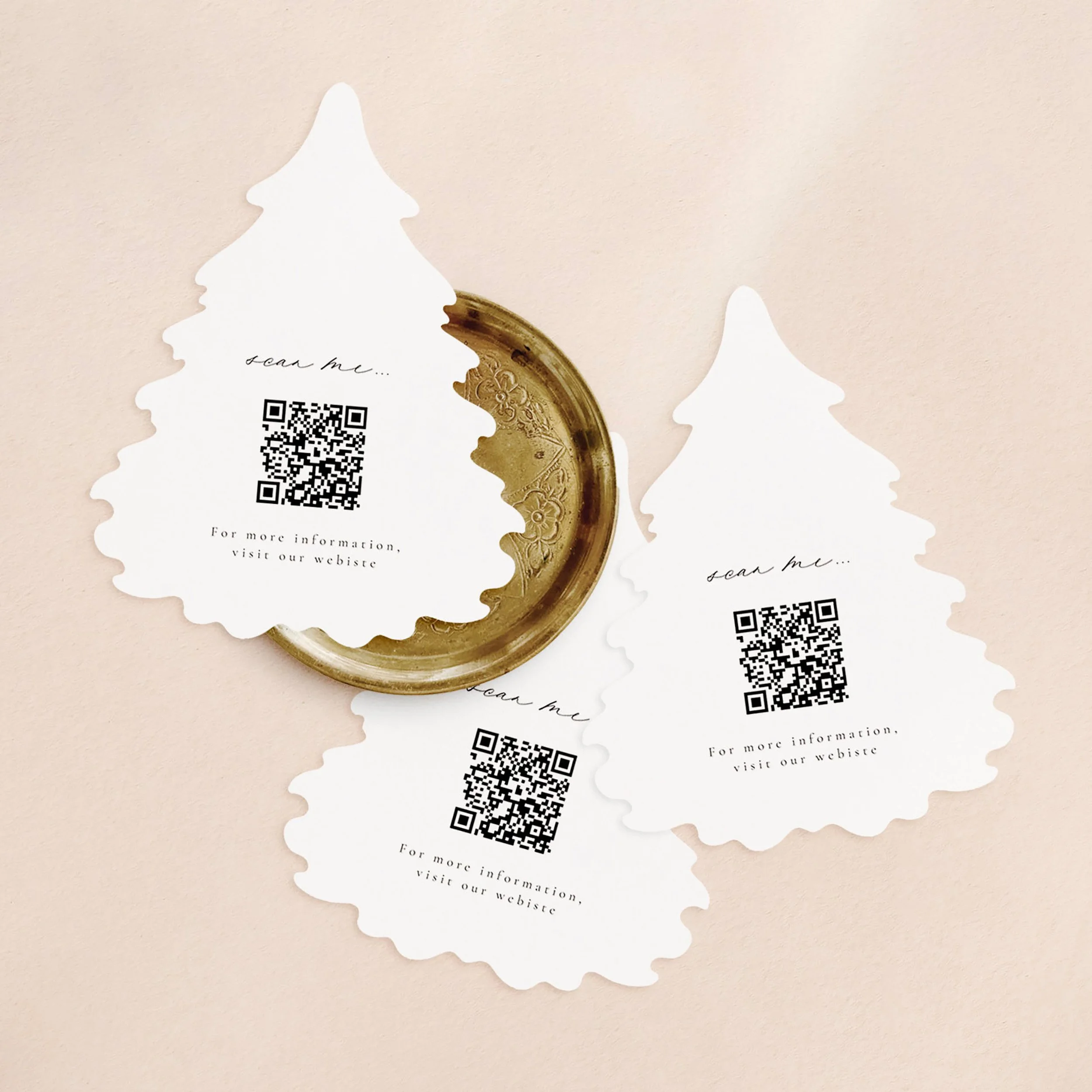 Three Christmas tree shaped cards with a qr codes.