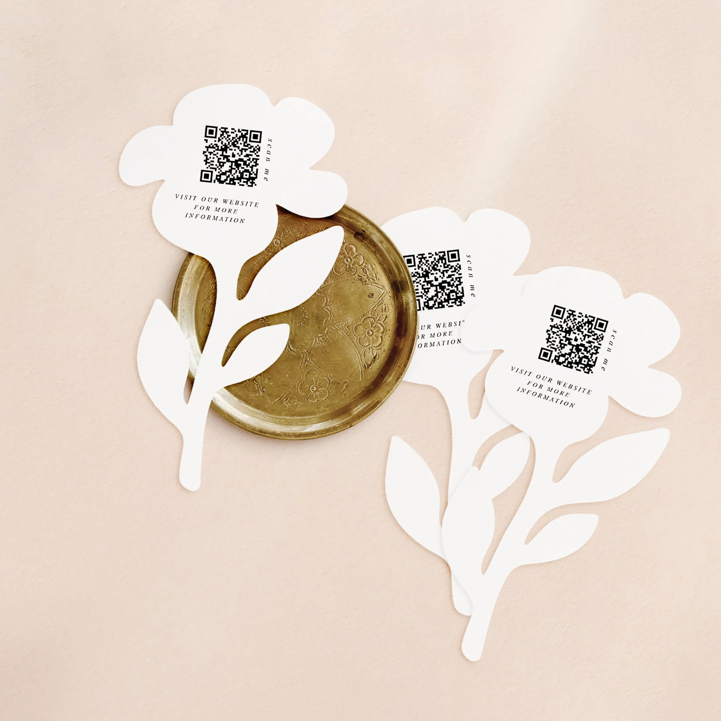 Three flower shaped cards with a qr codes printed on each.