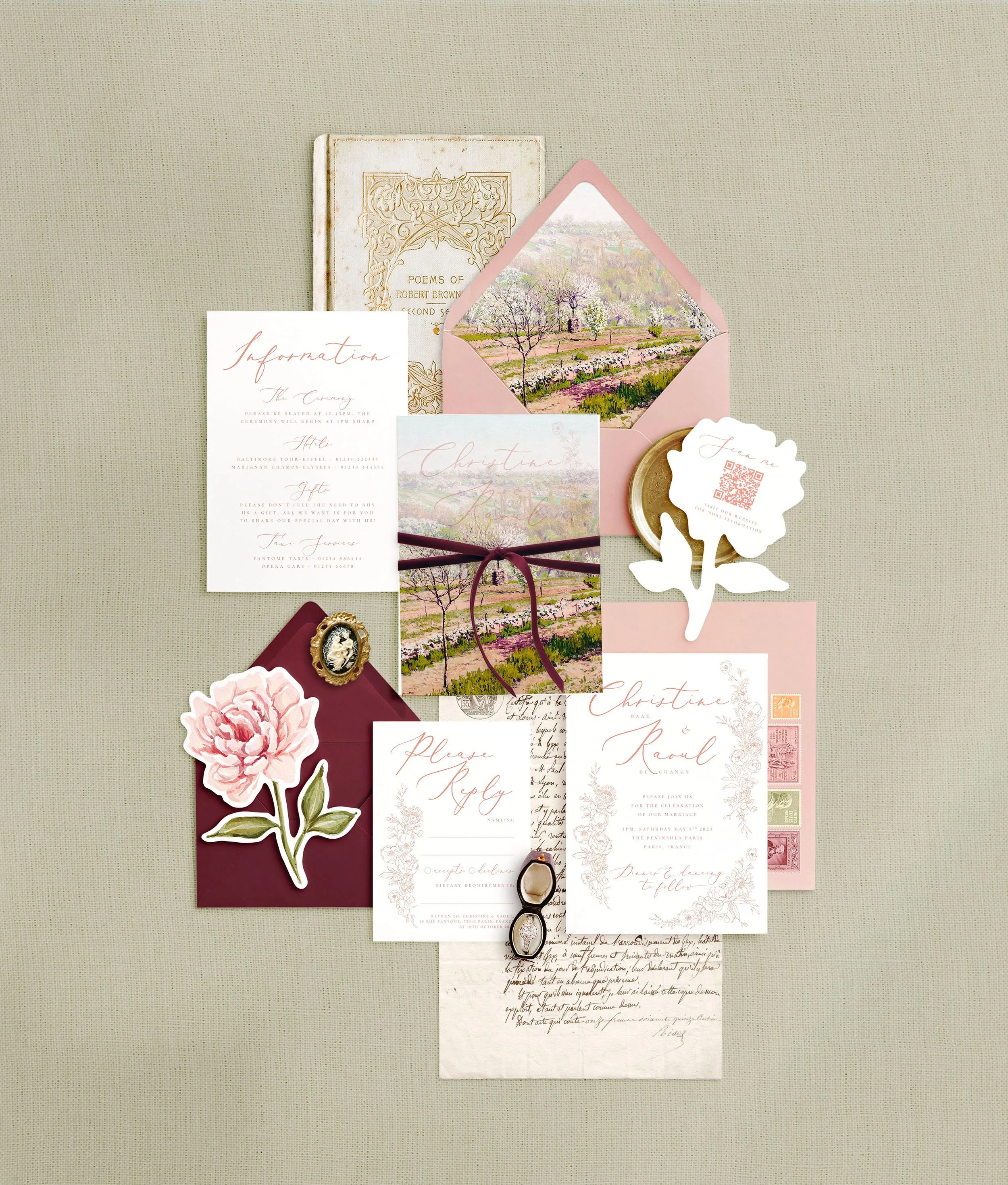 Wedding stationery flat lay featuring invitations, details, rsvp and a eucalyptus shaped qr code card. A delicate blush pink floral design.