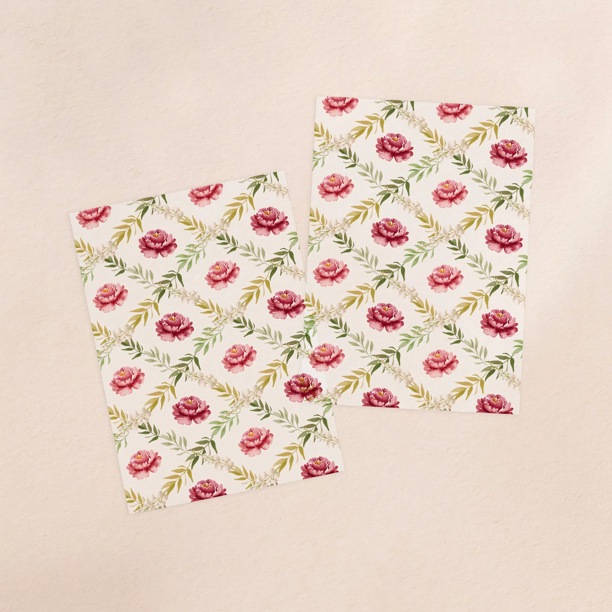 Two vellum paper overlay sheets with a burgundy floral pattern design