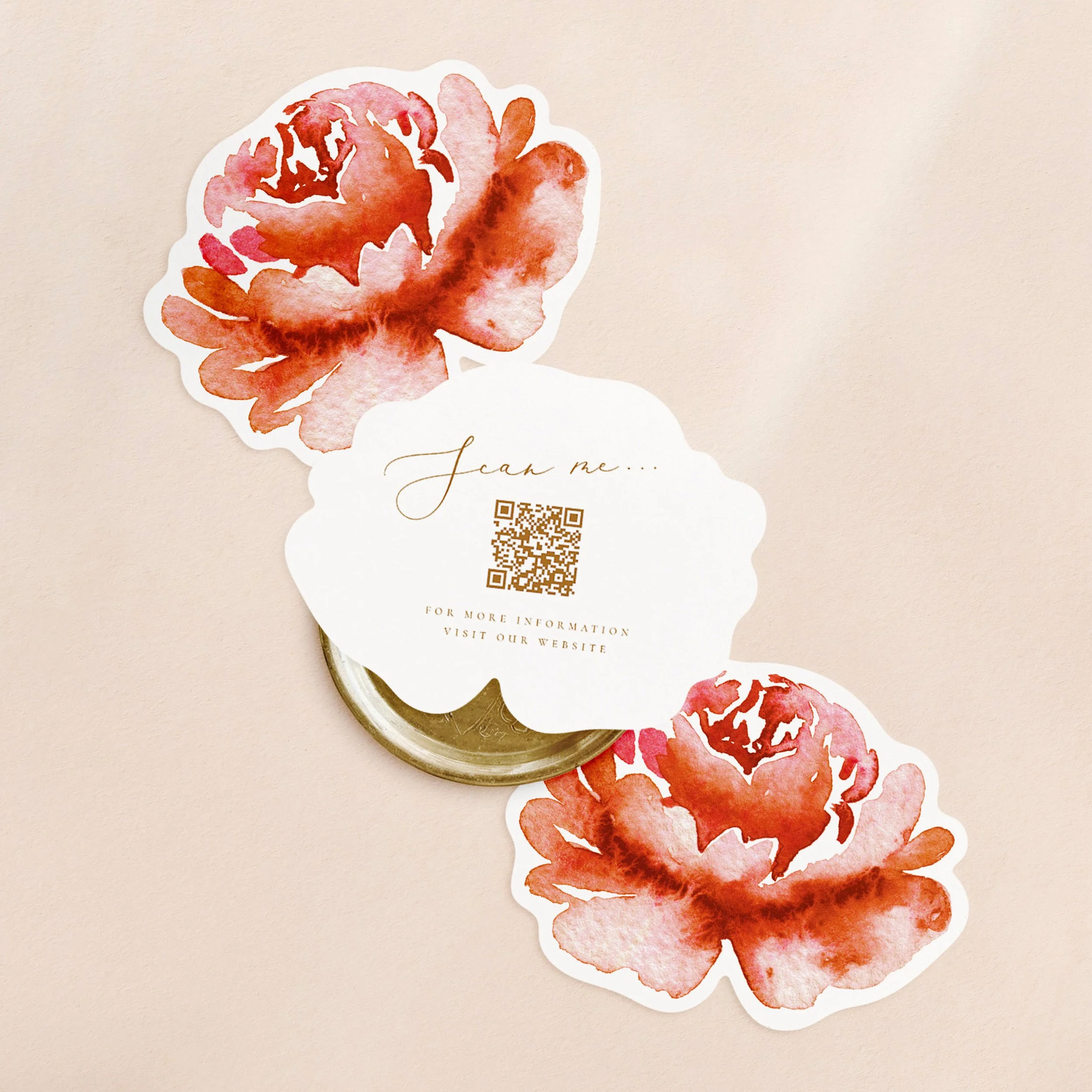 Three flower shaped cards with a red watercolour flower on one side and a qr code printed in gold text on the other.