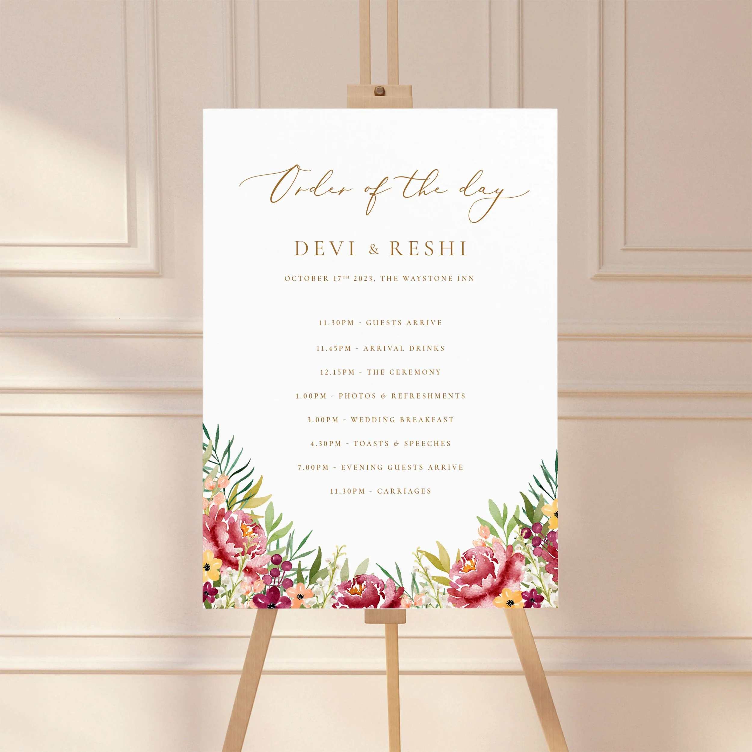 Large sign on an easel displaying a wedding order of the day timeline, featuring a floral burgundy autumn design