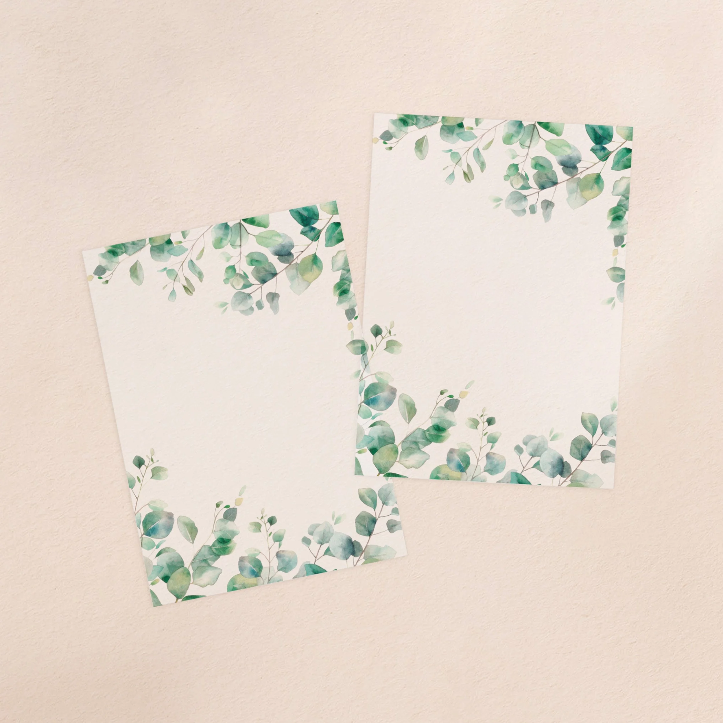 Two vellum paper overlay sheets with a eucalyptus leaf design