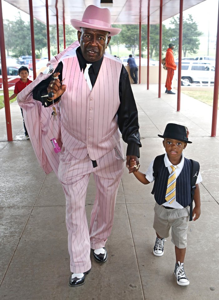   Arthur Washington walks with his step-grandson, kindergartner Jordan Franklin, on Friday. It was Take Your Child to School Day at F.D. Moon Elementary School. Photo by David McDaniel, The Oklahoman  