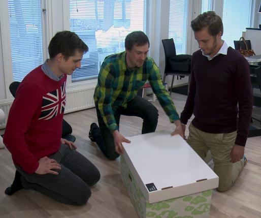  The founders of Finnish Baby Box Anton Danielsen, Heikki Tiittanen and Anssi Okkonen (L-R) pack their product in this still image taken from video in Espoo April 29, 2015. REUTERS/ATTILA CSER 