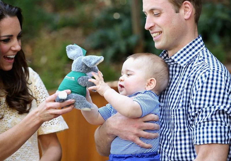 The duchess and duke play with Prince George. (Image: GettyImages)