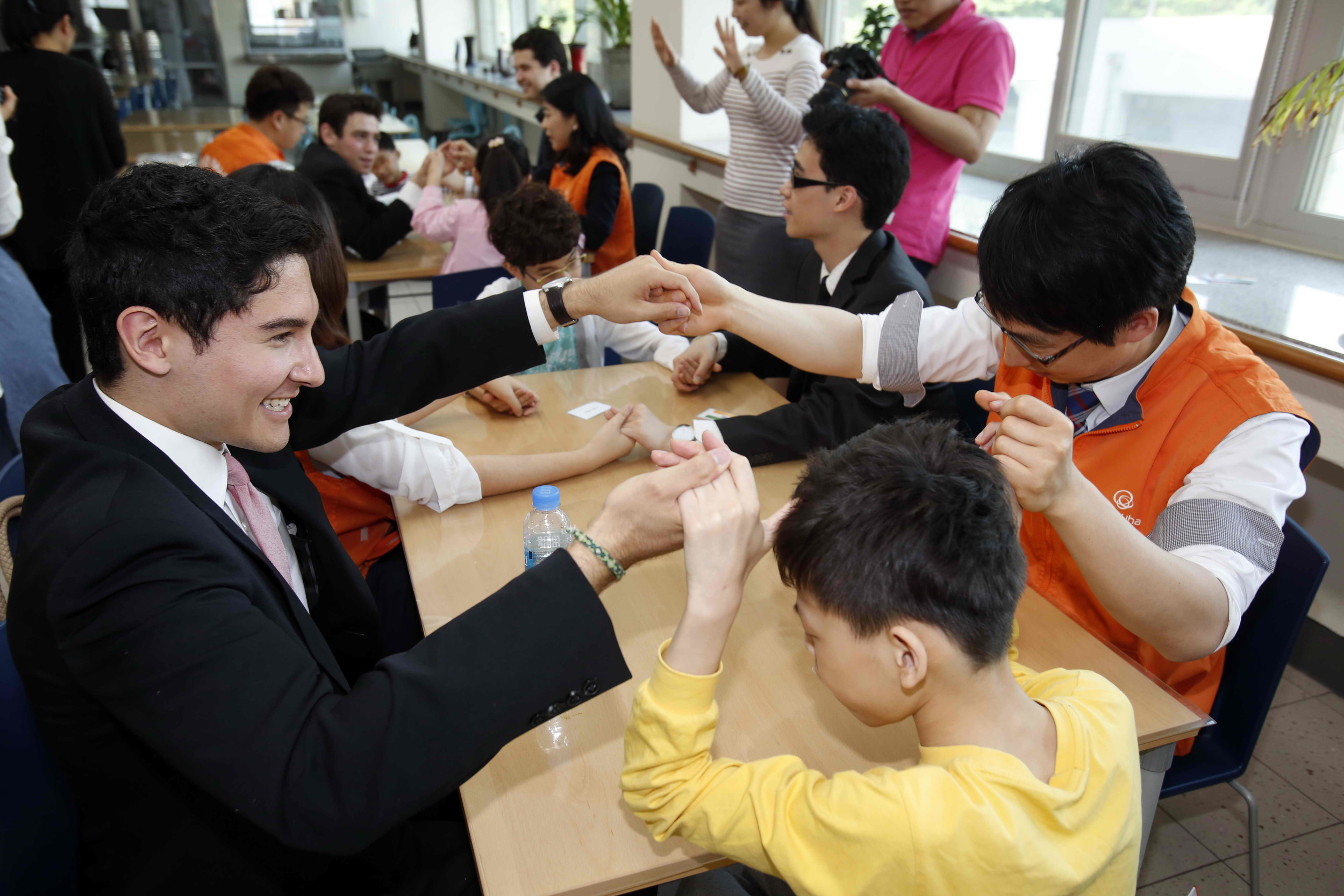 The Alley Cats interact with the students at the Seoul School for the Blind