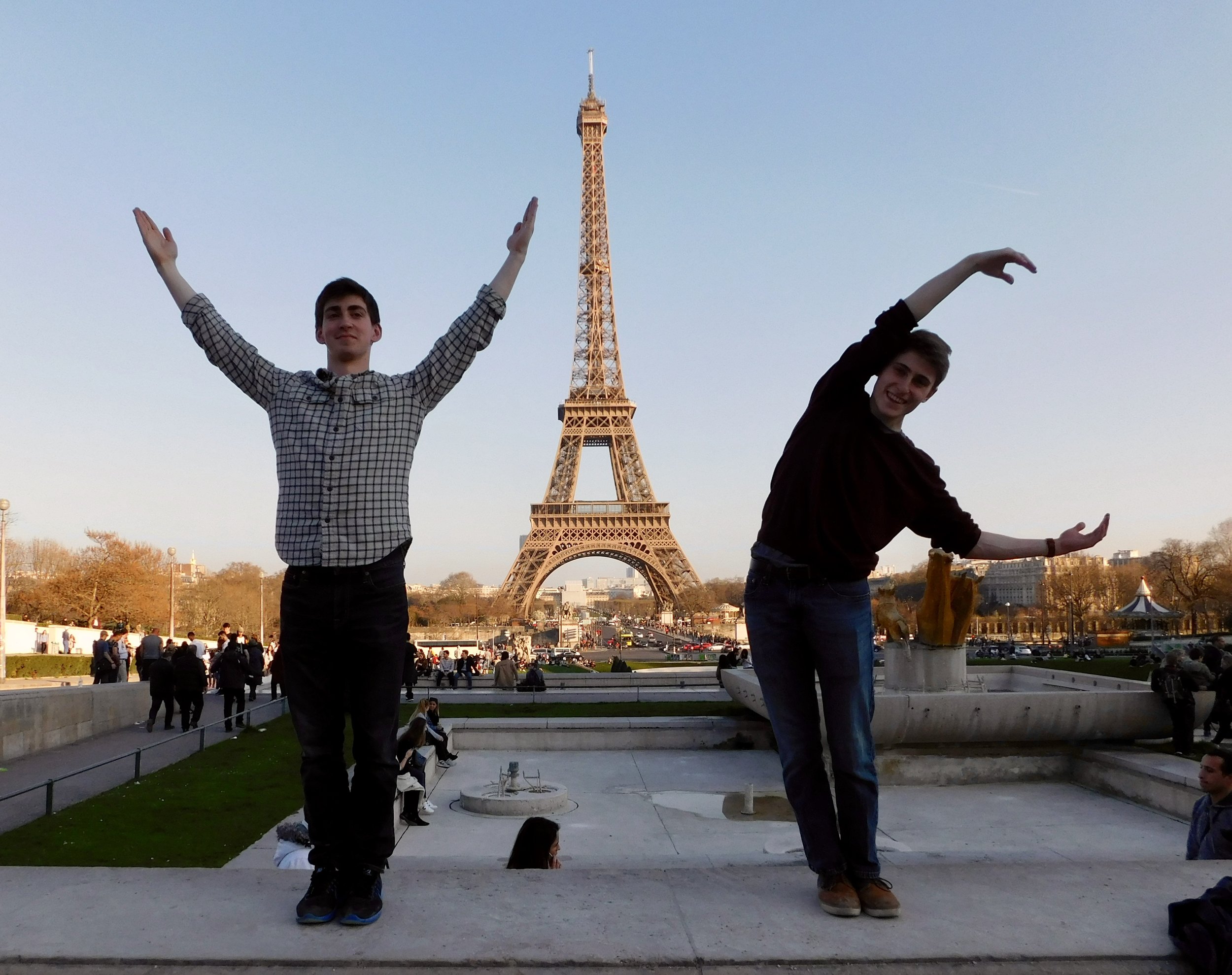  Jacob and Hale framing a "YAC" photo in front of the Eiffel Tower 