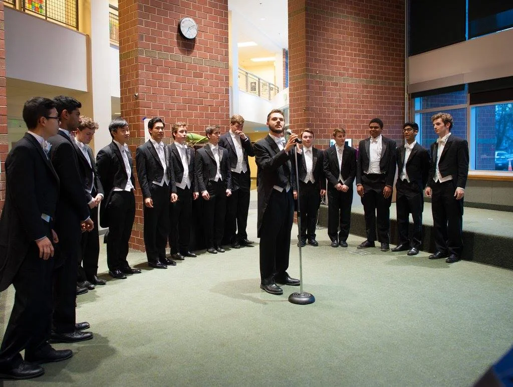 Eli '18+1 at the microphone at our public concert at Georgetown Day High School!