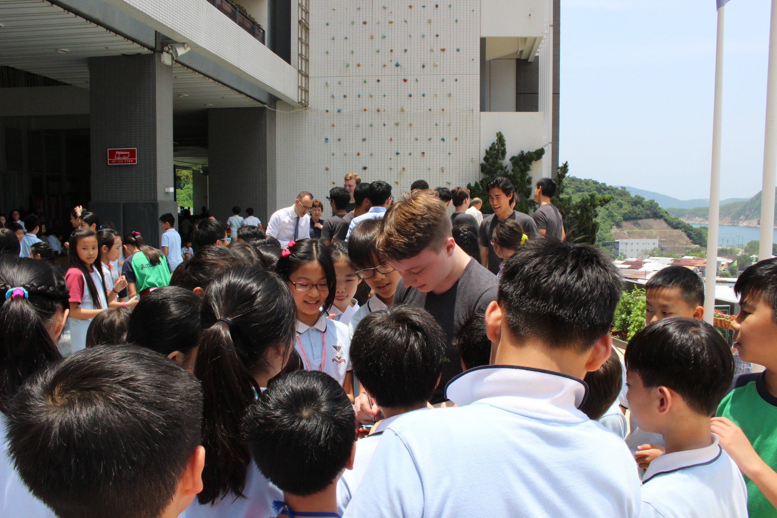  Shaun ('20) signing autographs with students after the concert 