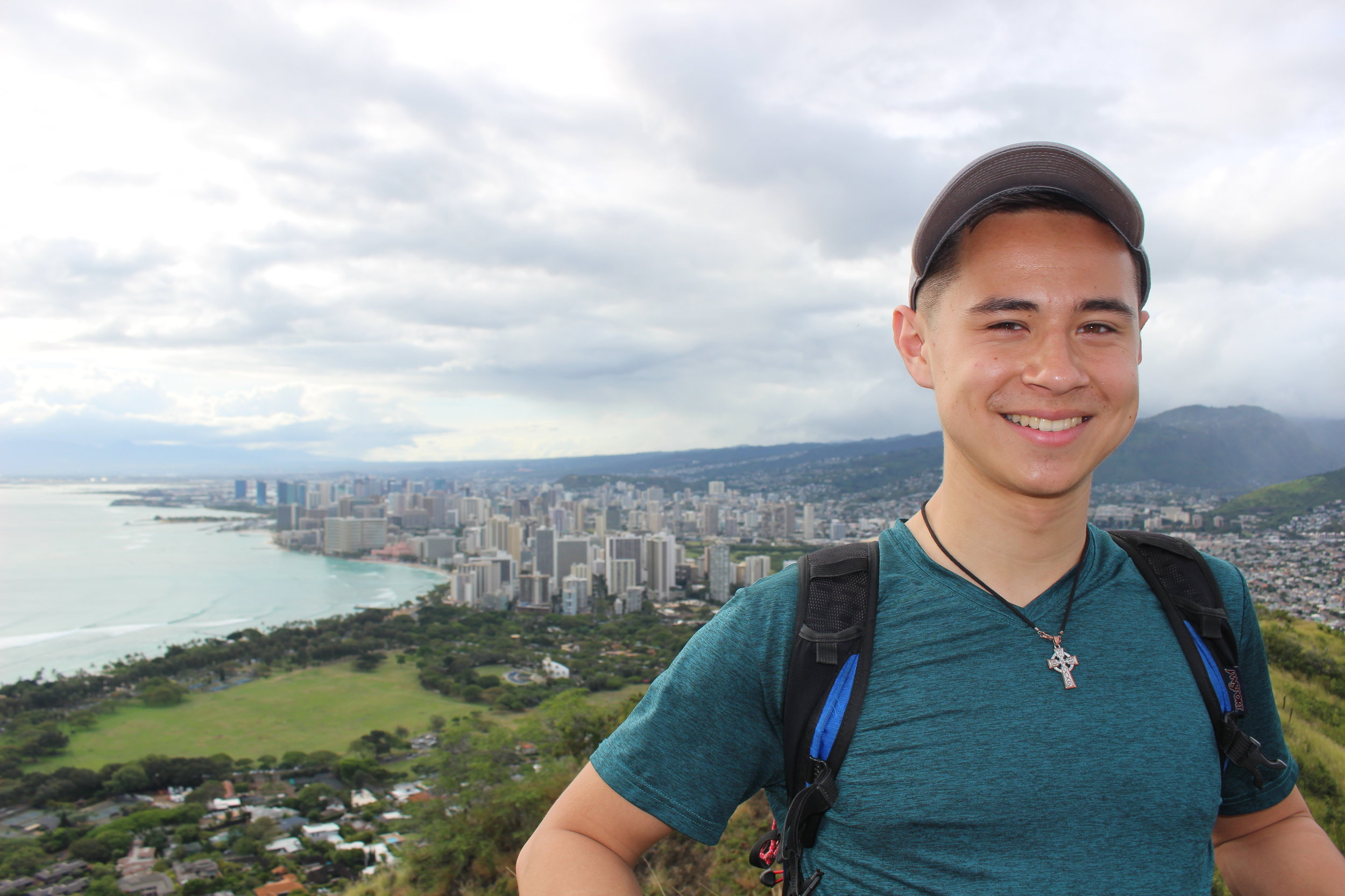  Liam ‘21 after hiking Diamond Head, with a view of Honolulu 