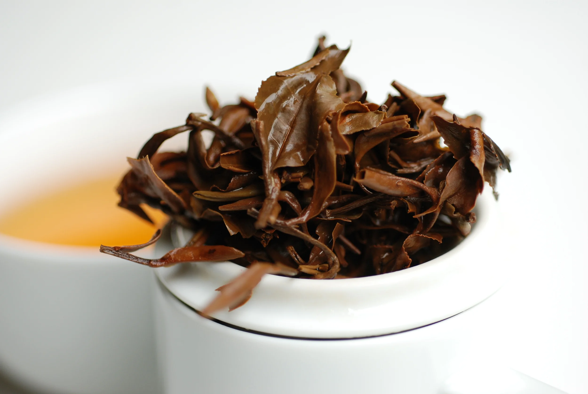 Second brew of the tea in standard tea cupping 3g / 150ml / 95 Celsius degrees. Notice the small leaves and buds. 