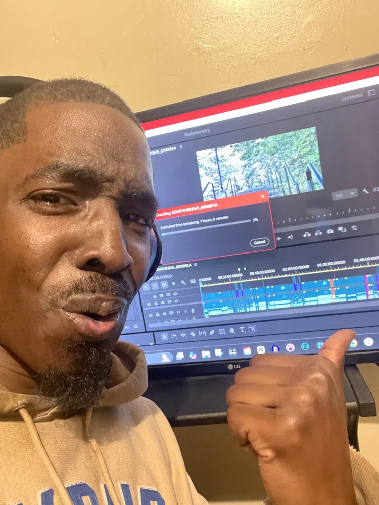 John Kind reviewing a video edit during post-production at John Kind Studios.