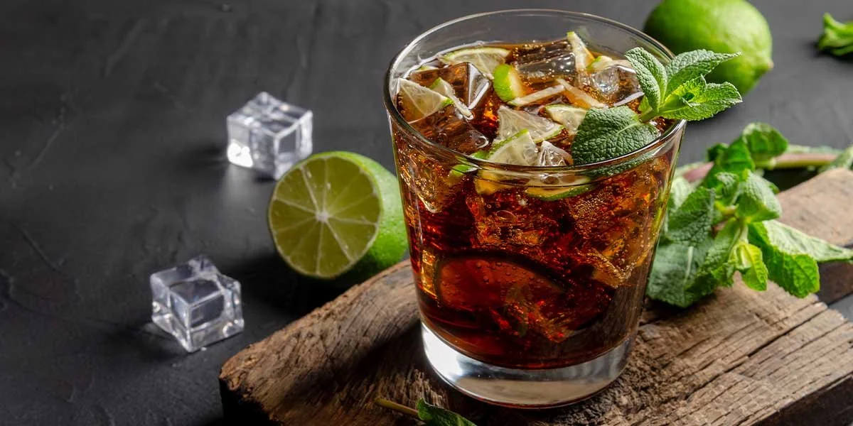 Coke Julep made with coke, gin and mint liqueur, this creative