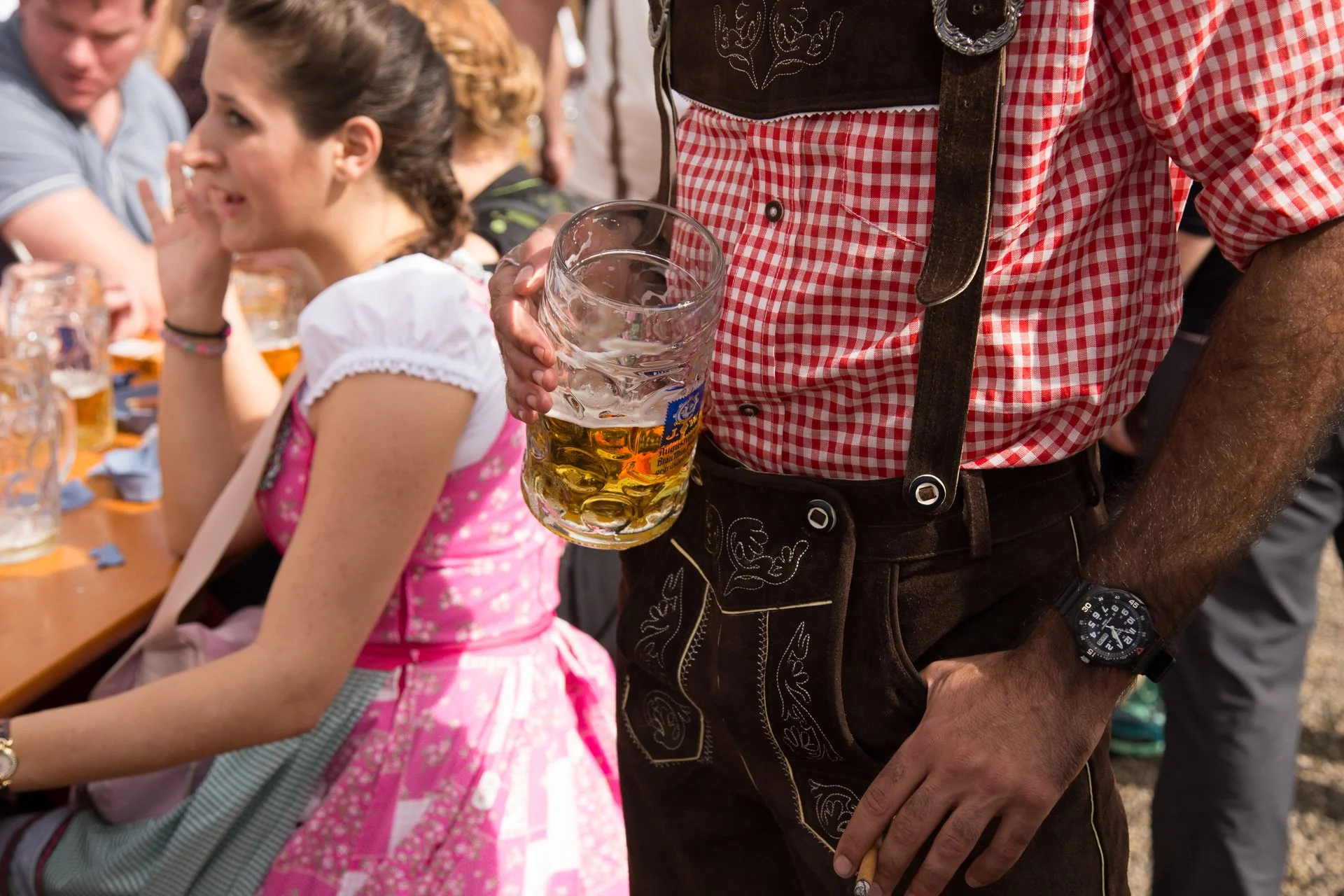 Men traditionally wear lederhosen and women in dirndl.