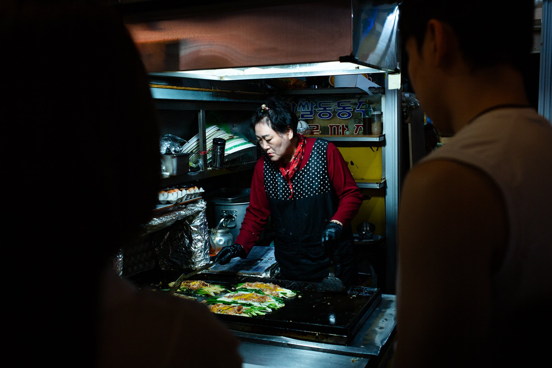 Explore the bustling night scene near Haeundae Beach for a taste of delicious street food.