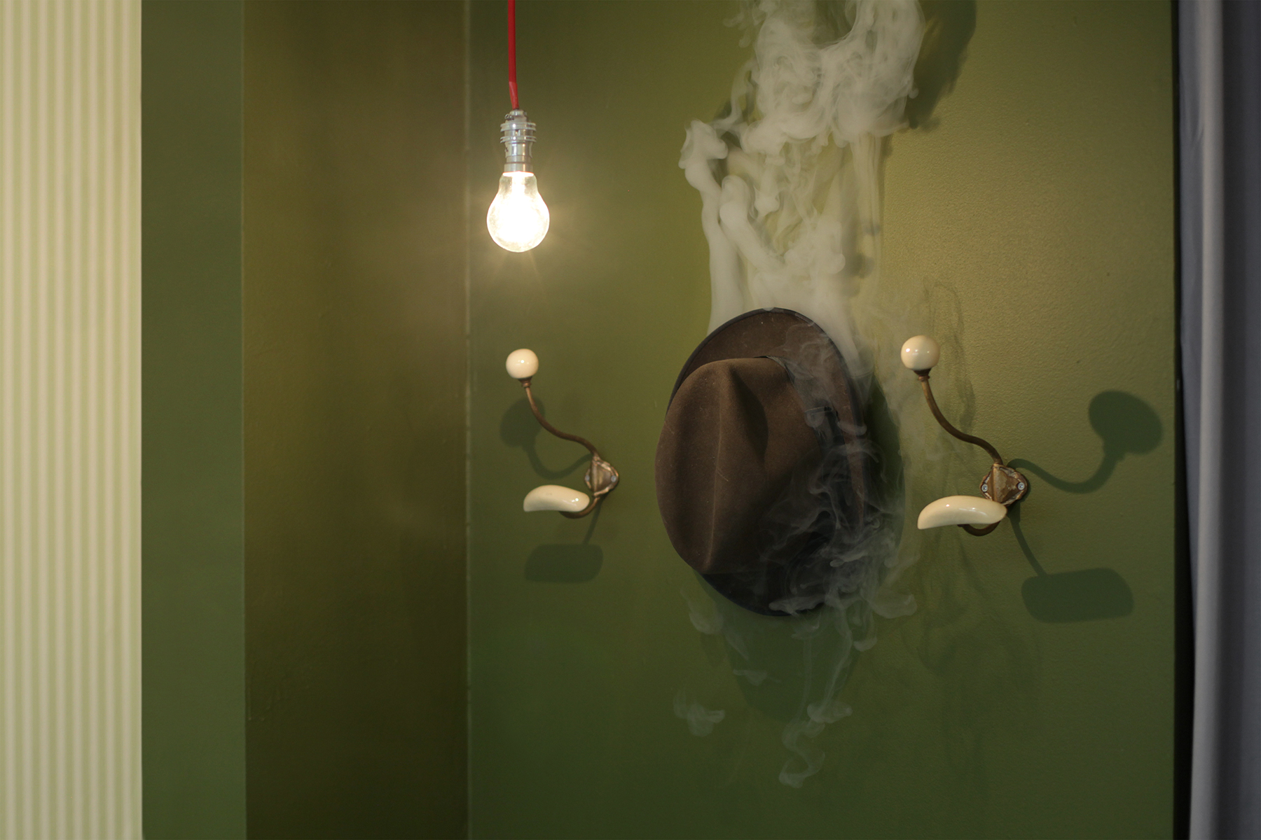 «Monseur Chapeau» (2012) Coat hangers, hat, smoke. 25 x 100 x 25 cm Ed: Unique - Installation view: Lars Morell «Hotel Paris» Galerie Nivet-Carzon, Paris. 16.09 - 20.10.2012.