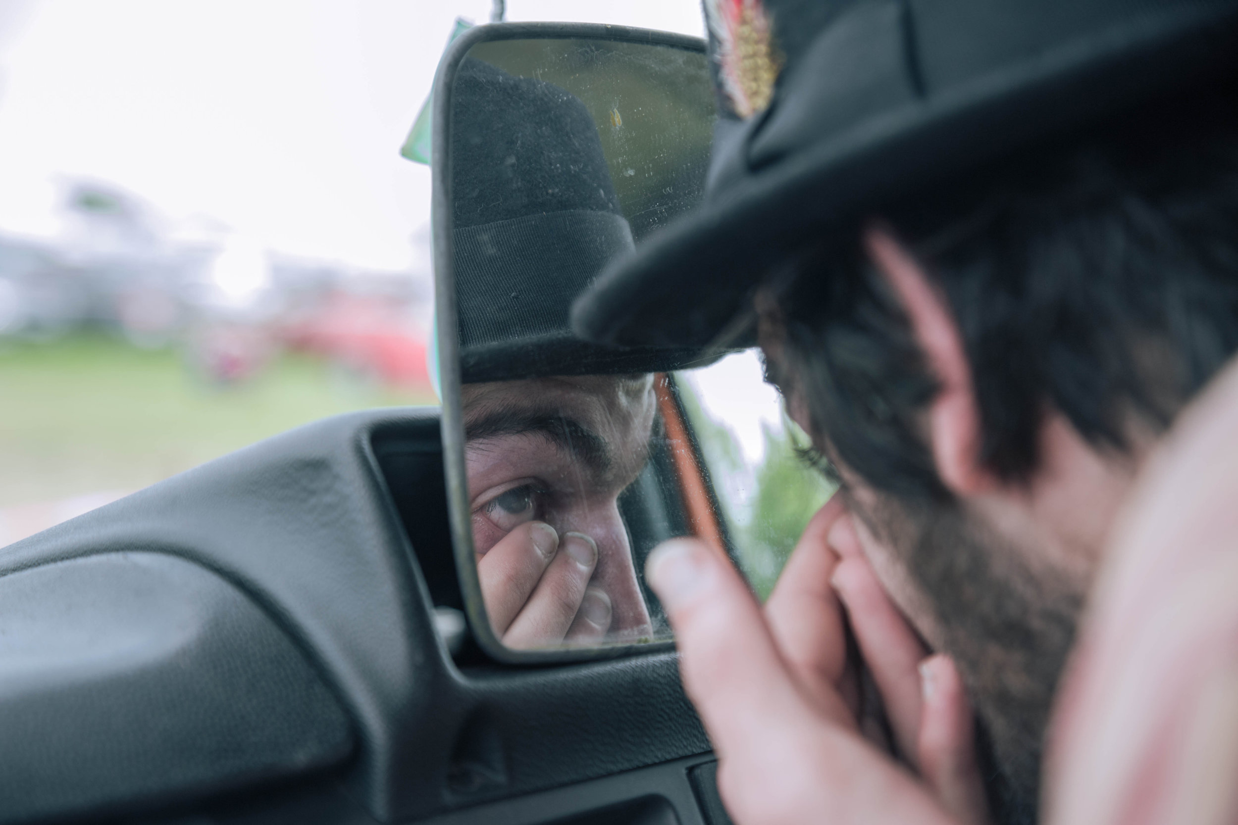 The morning routine of Guy putting on his contacts for the day