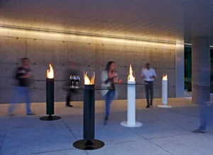 A collaboration between Acquaefuoco and A.S. created the Apollo fireplace, a collection of simply shaped bioethanol fireplaces designed for outdoors. The shaped base is properly designed to diffuse sound. A powerful A.S. speaker is housed in the overhead cylinder, which also contains the burner. Thank to the emission system the sound is spread in a very natural way, giving an involving and hearty sense of relax. These are elements that exalt fire and evoke the pleasure and harmony of being together. The collection is divided into fireplaces suitable for domestic use and those for bars, restaurants and hotels.