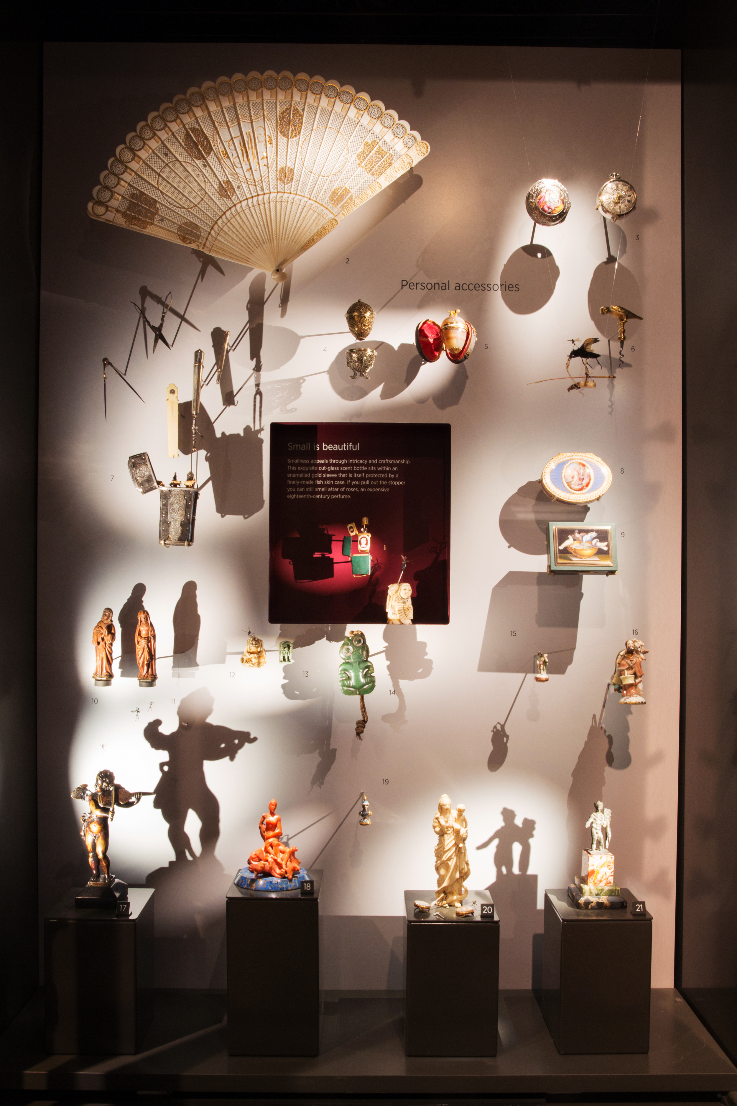 Inside the 'Small Wonders' cabinet fairies hide in the shadows, attacking netsuke with scissors and dancing to the violinist putto.