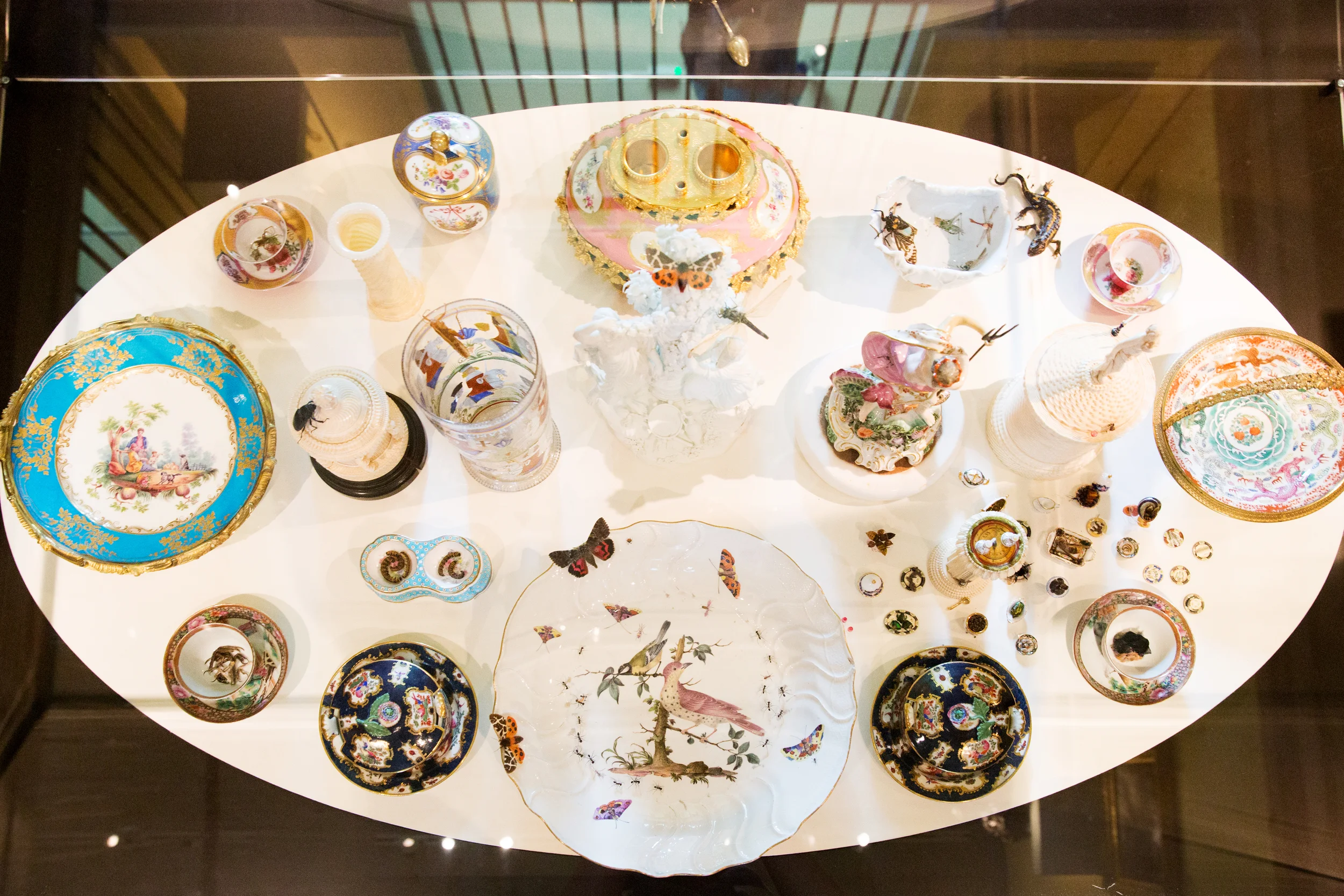 Below, the fairies observe the fracas they have created, indulging in a lavish banquet amongst the ornate tableware. Moths, grasshoppers, ants, beetles and dragonflies emerge from painted depictions before being hunted and feasted upon.