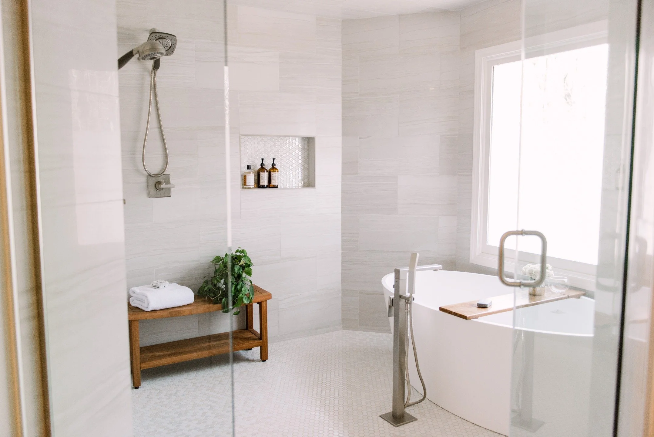 We reimagined the space with a freestanding soaking tub, dual shower heads, and a steam unit—all layered with warm textures like a teak bench. Now it’s not just a bathroom, it’s an experience of relaxation and rejuvenation. 
Before