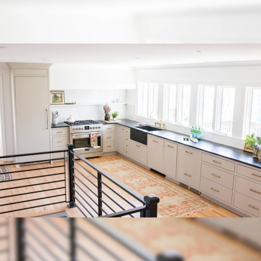 Natural light was a big inspiration for this kitchen design. With windows above the sink, beautiful soapstone countertops, and an open layout, the space feels airy and welcoming. 

The lower cabinetry is designed mostly with drawers for smart storage
