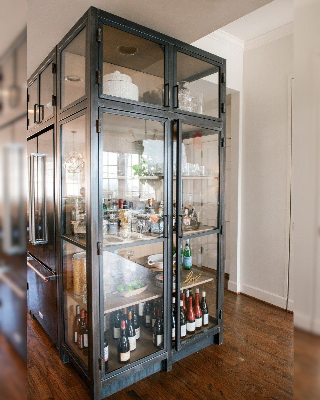 An elegant approach to kitchen storage. This steel pantry was designed to support effortless hosting with space for cocktails, glassware, and curated details. 

Swipe to see the before!