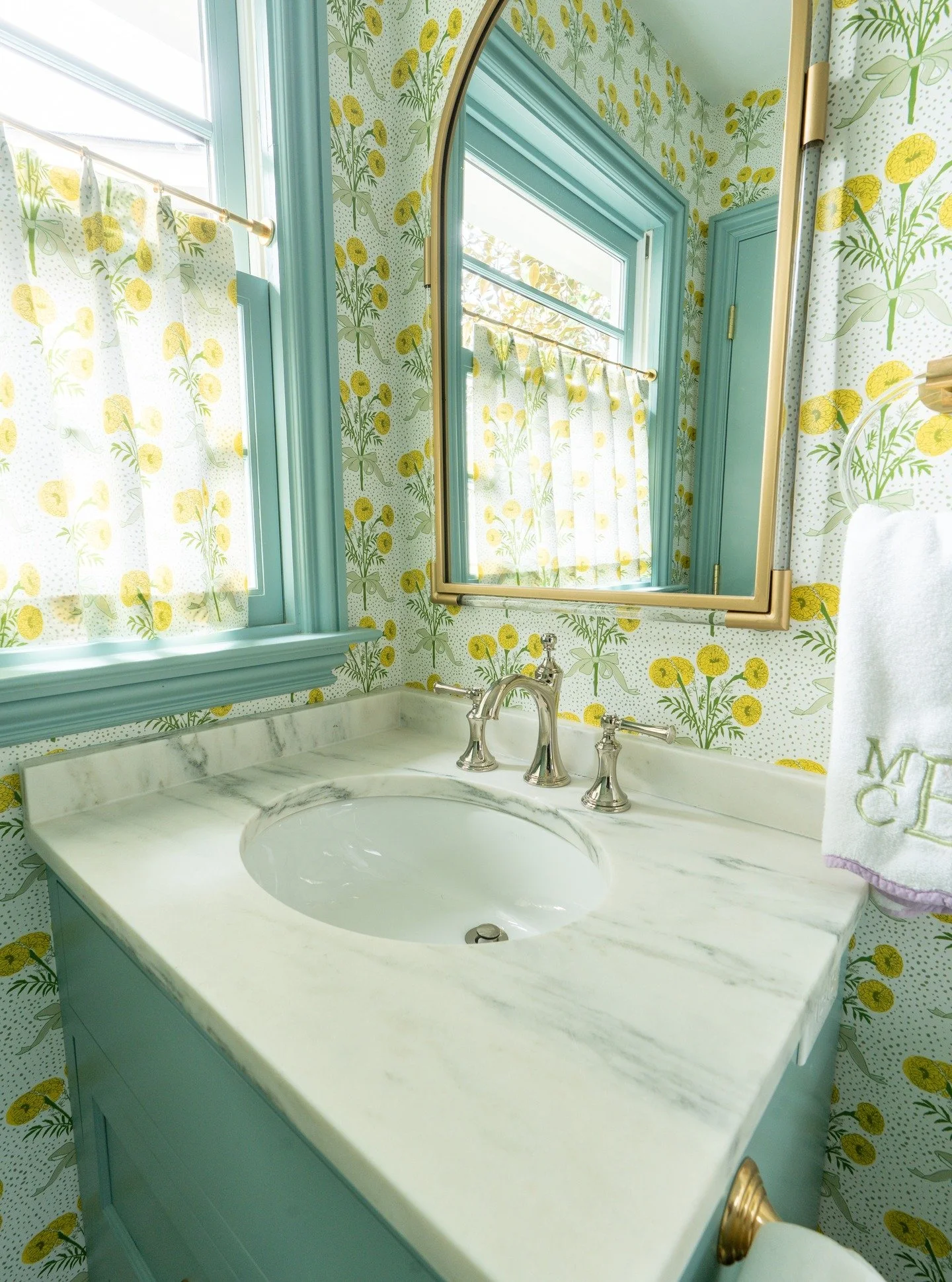 This little bathroom is giving Easter vibes in the best way. The green vanity paired with yellow floral wallpaper brings a cheerful touch to your morning routine. 

Add a little extra pop of green on the trim, and it&rsquo;s perfect!

What do you thi