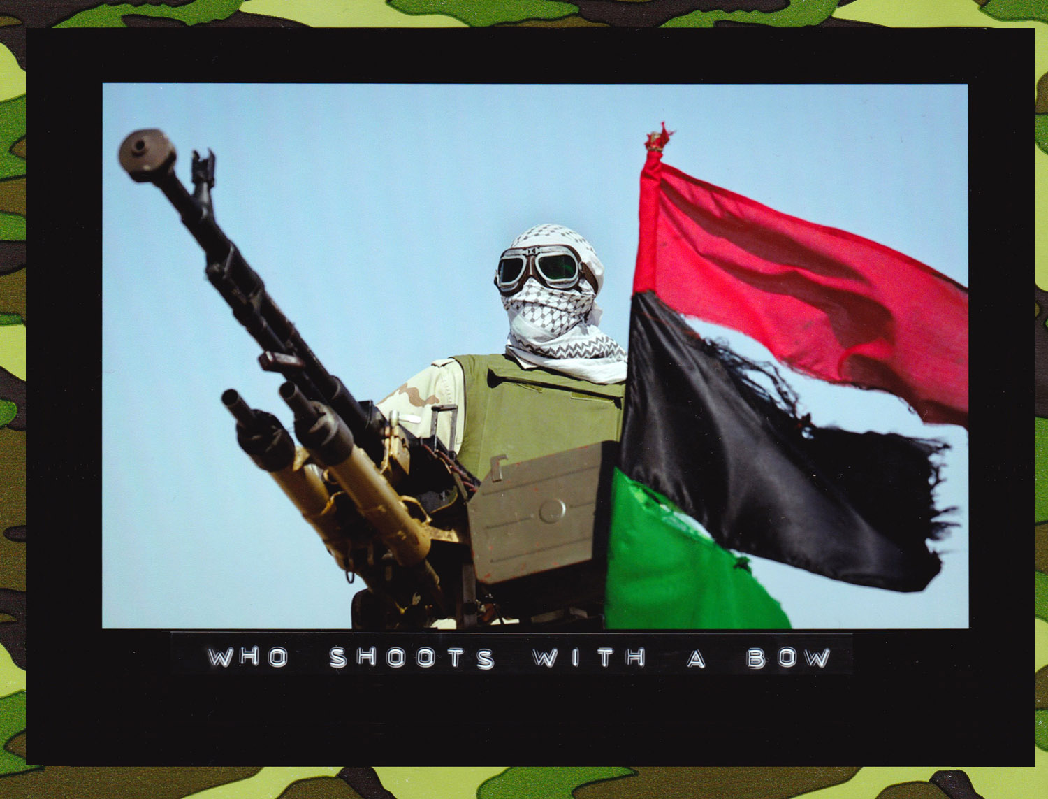 A rebel fighter mans an antiaircraft gun, next to an opposition flag, in the desert on the outskirts of Ajdabiya, Libya, 2011. (Photo: Ben Curtis/Associated Press)