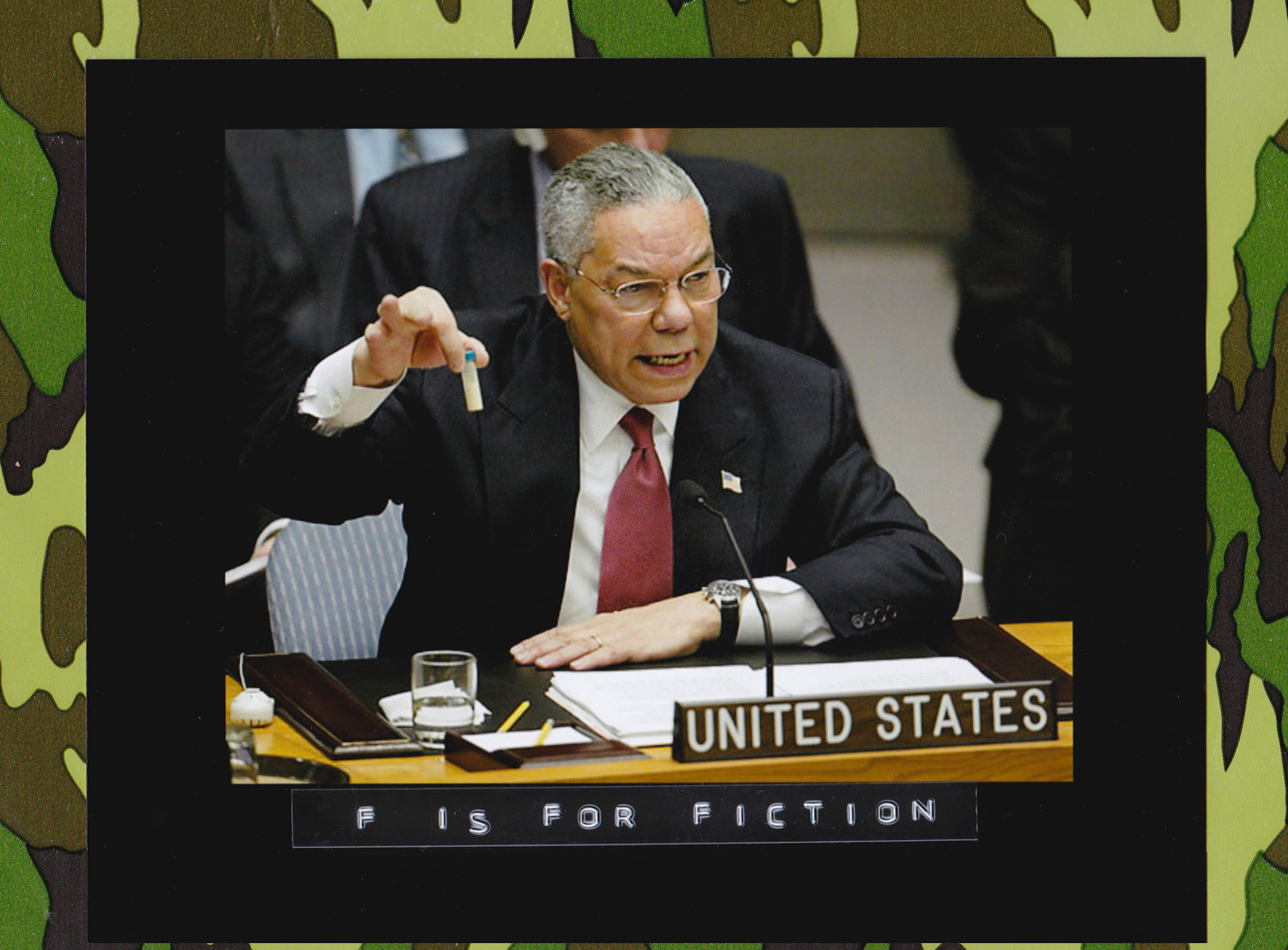 In his Feb. 5, 2003 address to the United Nations Security Council, U.S. Secretary of State Colin Powell holds up a vial he said could contain anthrax as he presents evidence of Iraq's alleged weapons programs. (Photo: Ray Stubblebine/Reuters)