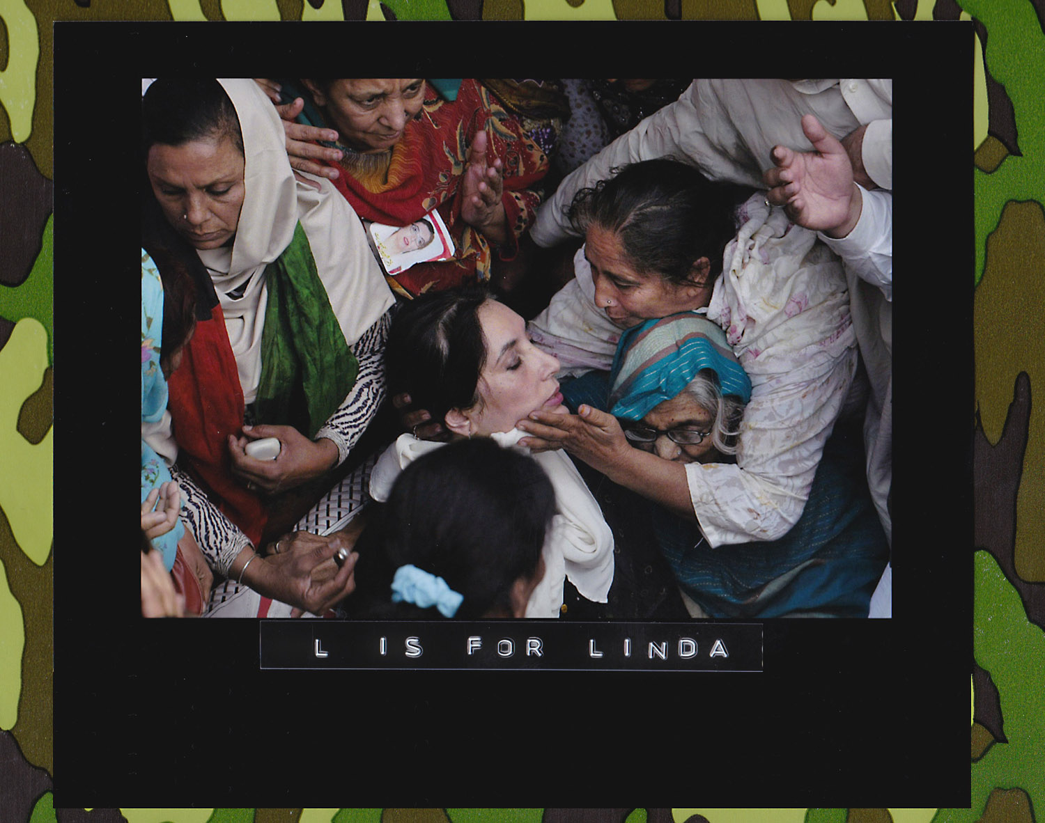 Women surround Benazir Bhutto during a campaign stop on the outskirts of Lahore, Pakistan on November 12, 2007. Bhutto visited a home of a woman who lost her son in an Oct. 18 bombing in Karachi when Bhutto returned from exile to Pakistan. (Photo: David Guttenfelder/Associated Press)