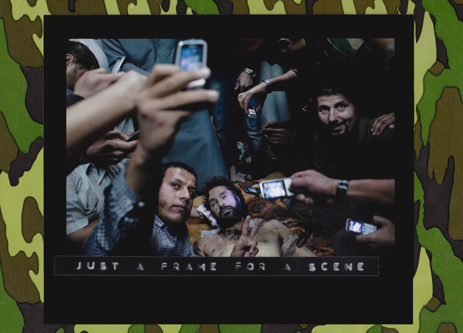 Libyans pose for pictures with the body of Muatassim el-Qaddafi, the son of Colonel Qaddafi, at a house in Misurata, Oct 19, 2011. (Photo: Mauricio Lima//The New York Times).