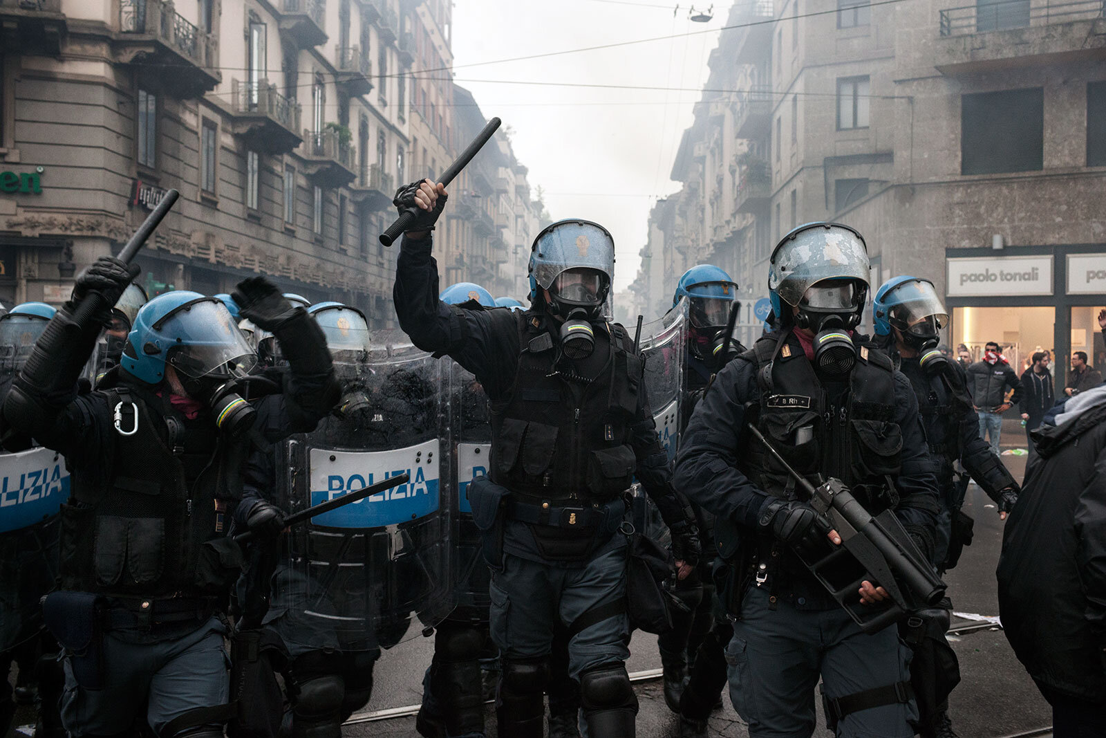  Riot police officers prepare to charge protestors during riots on May 2015 in Milan, Italy. 