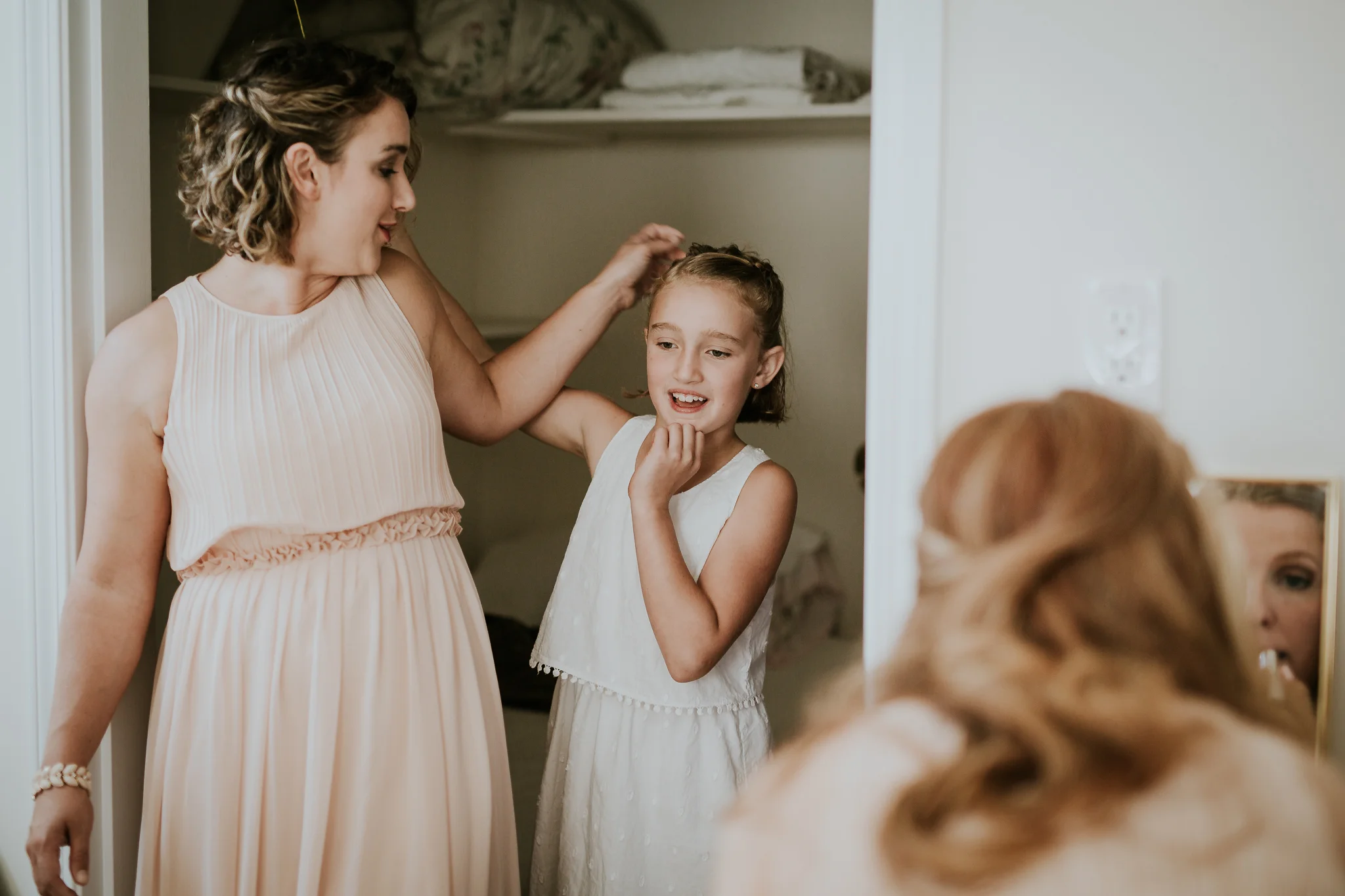 Bridesmaid and flower girl getting ready at Starling Lane Winery wedding