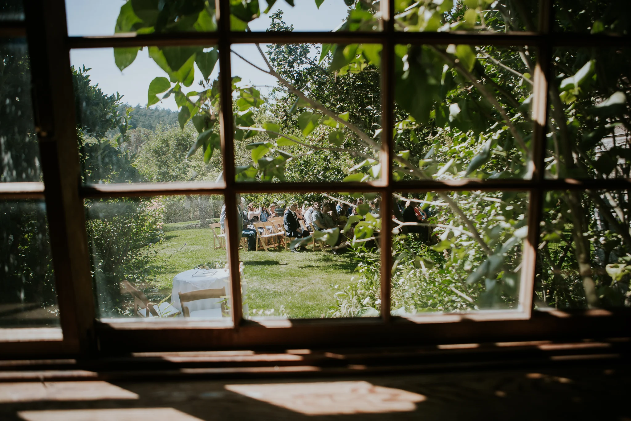 View of wedding ceremony site through window at Starling Lane winery