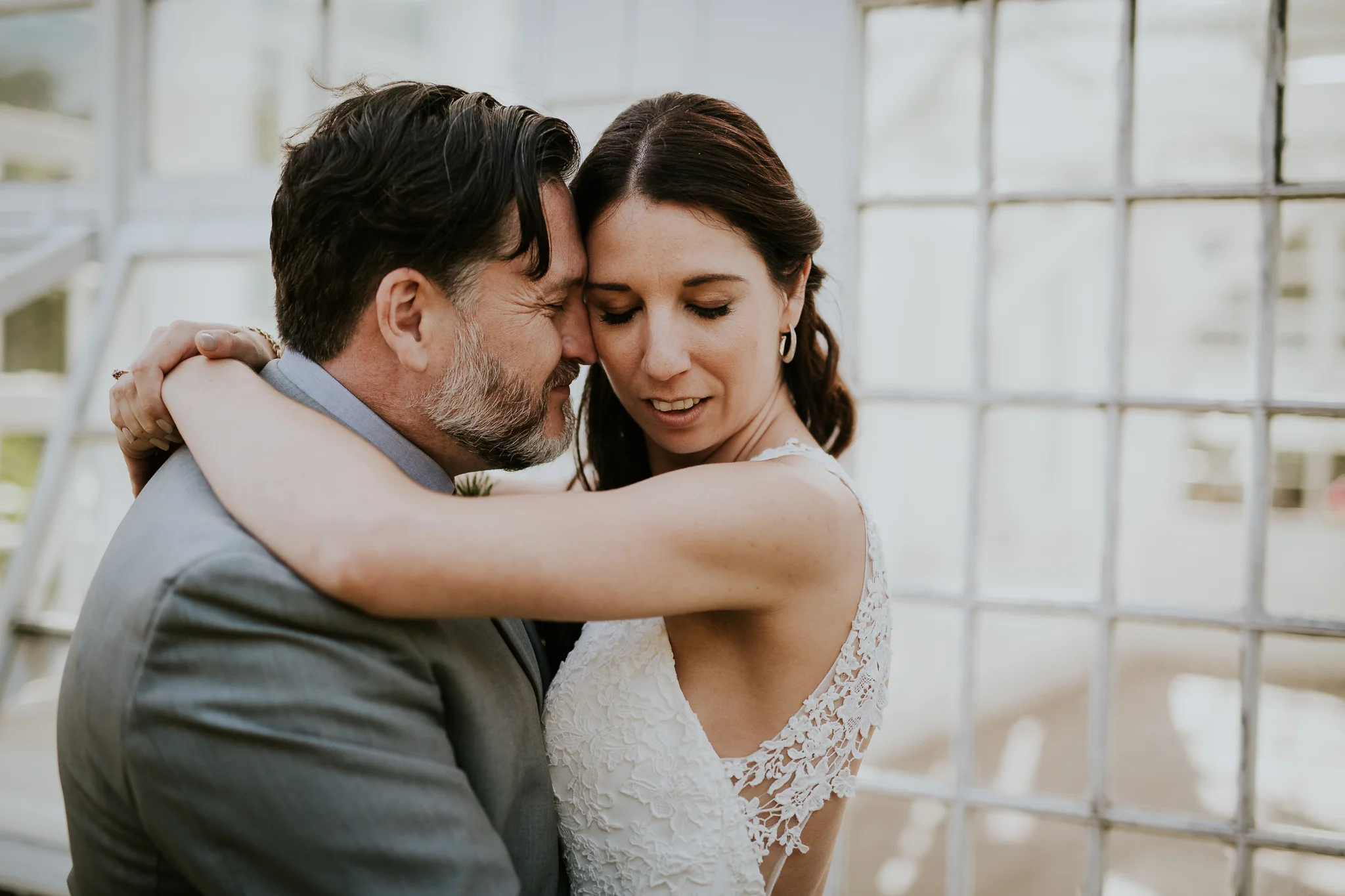Bride and groom at greenhouse for wedding photos in Victoria BC