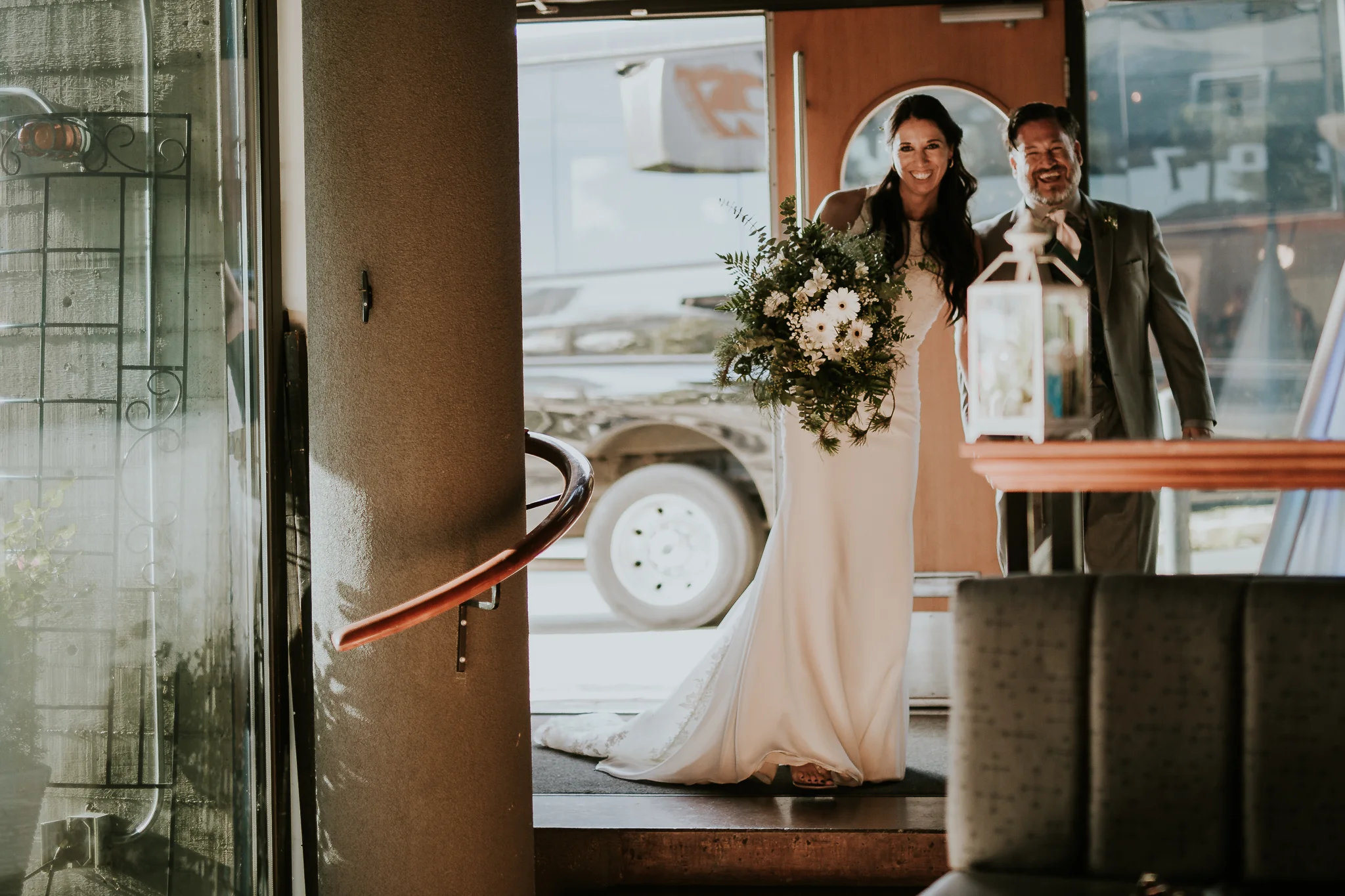 Bride and groom arriving at wedding reception venue in Inner Harbour Victoria Bc