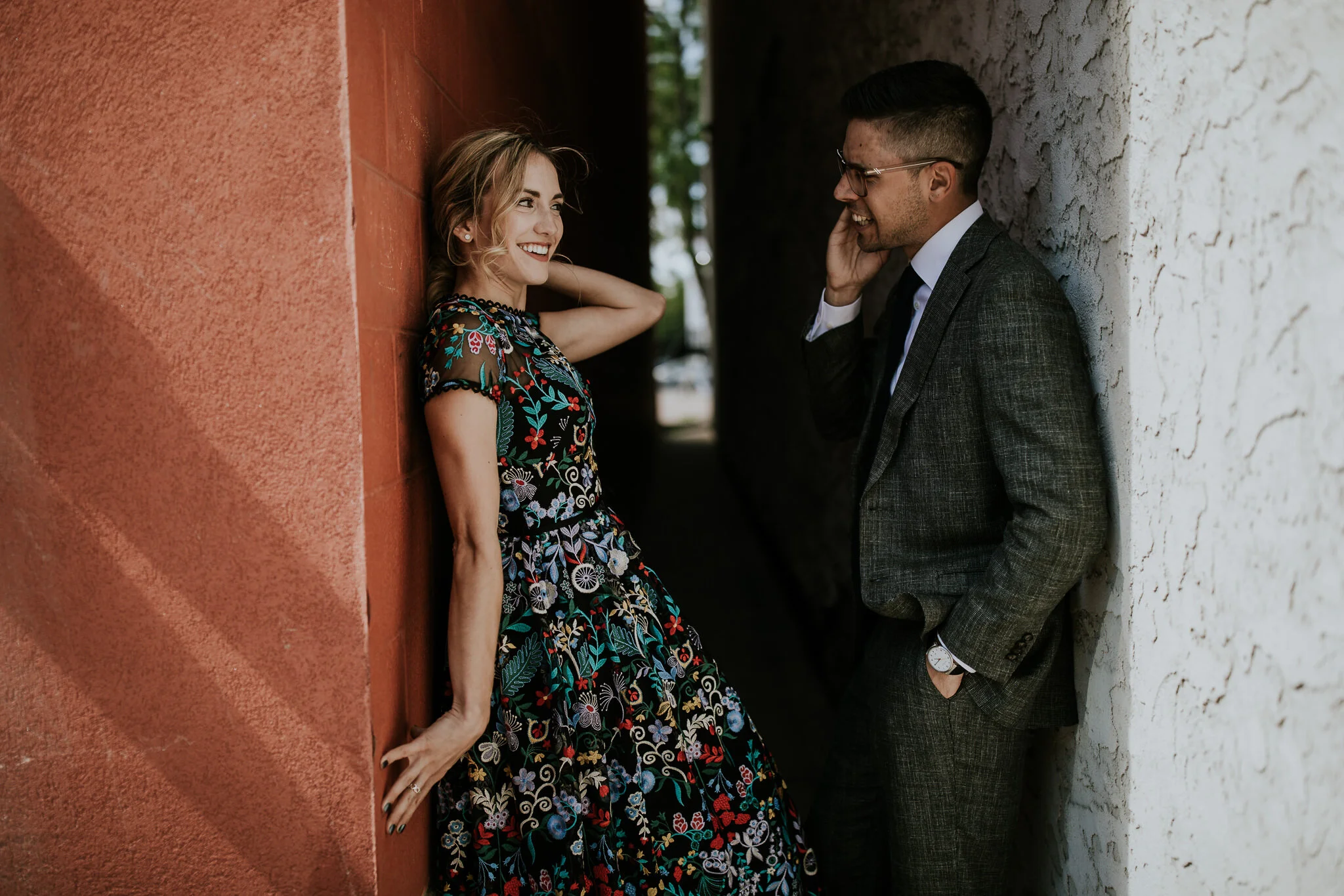 Bride and groom with rad style taking wedding photos in alleyway in downtown Calgary