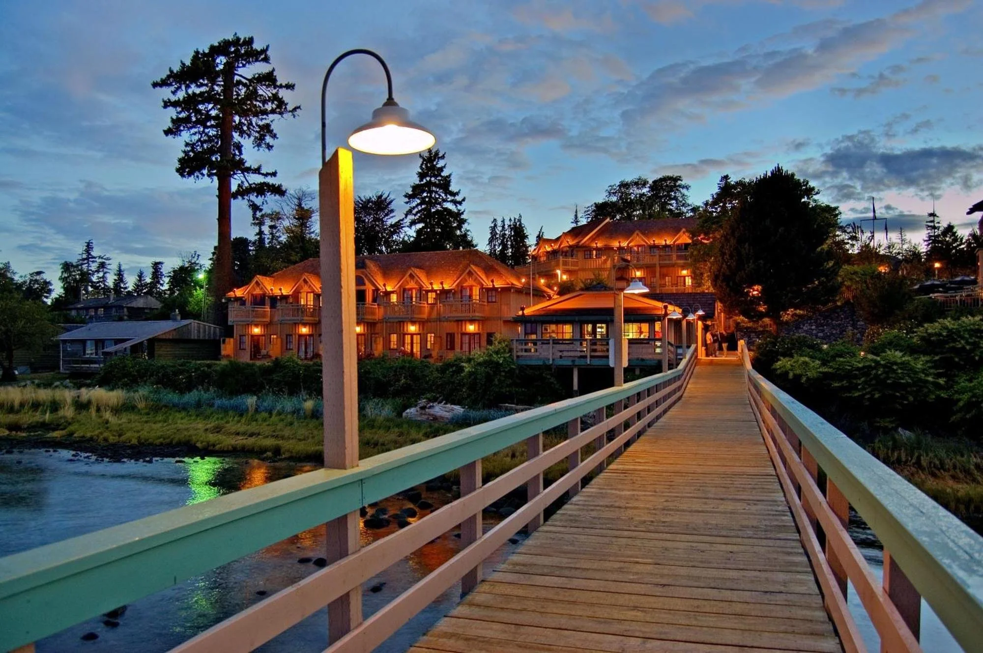 exterior of boardwalk at painters lodge in campbell river vancouver island wedding venue at dusk