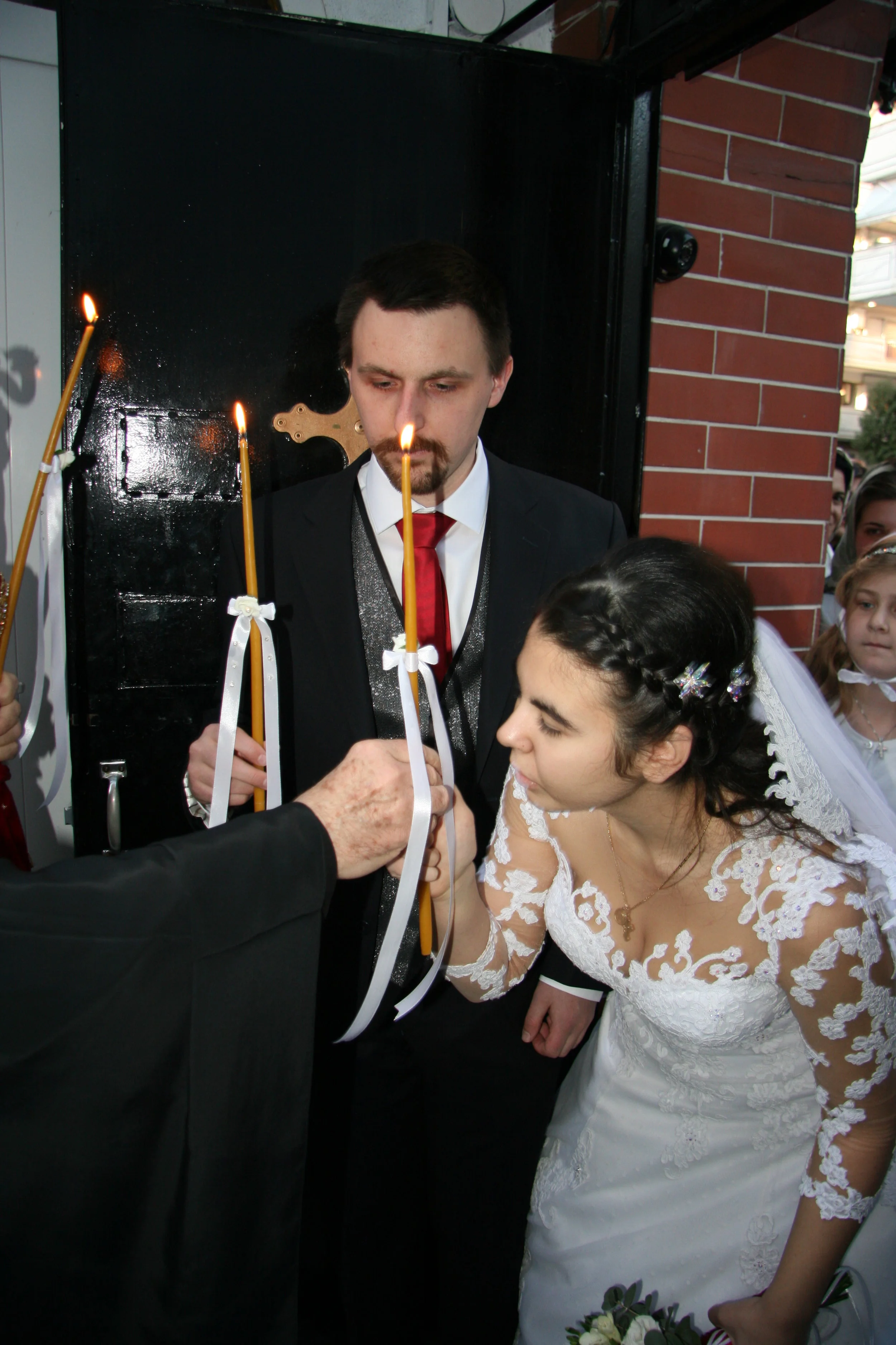 John & Sophia light the candles