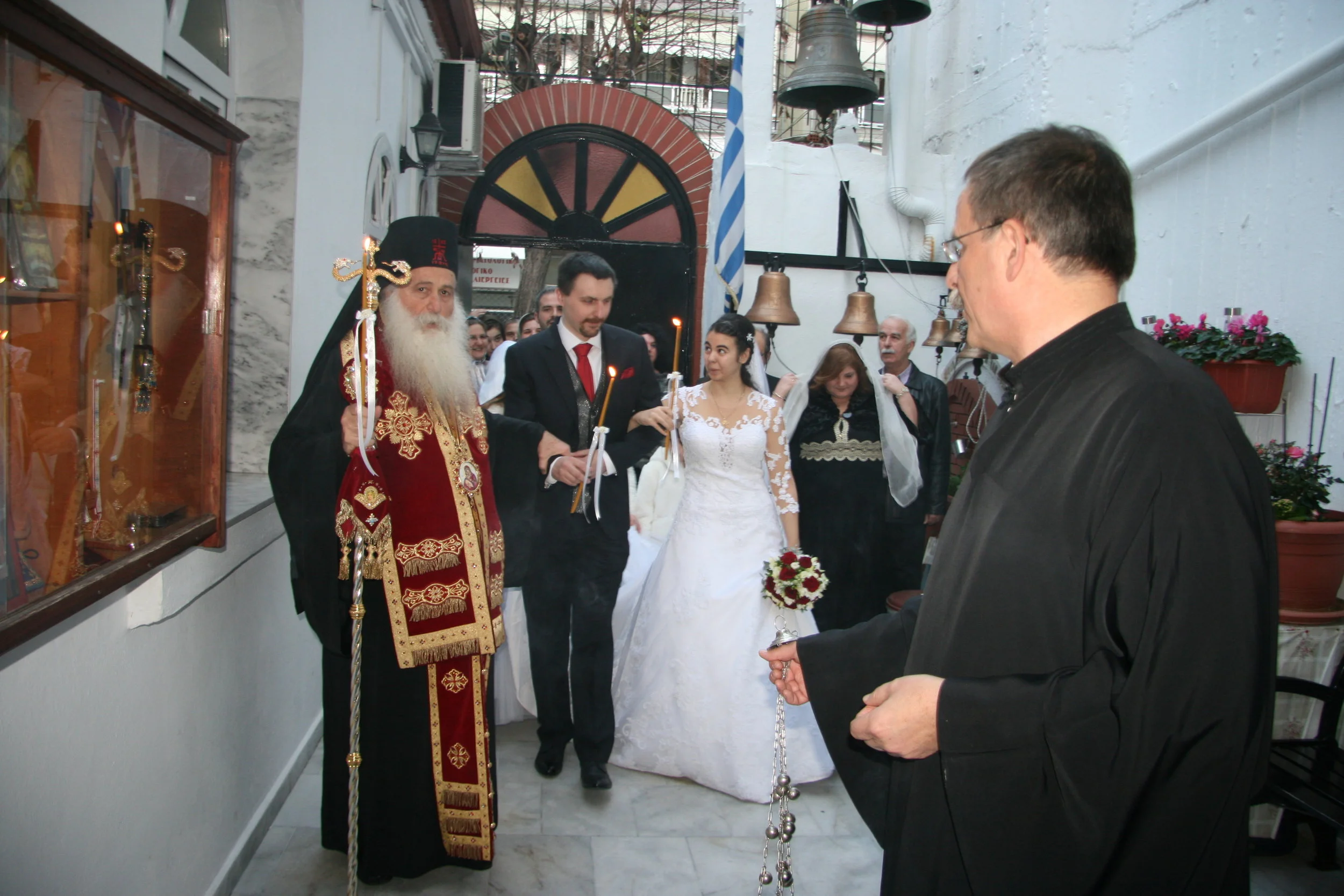 Dimi in reader’s robe, holding censer