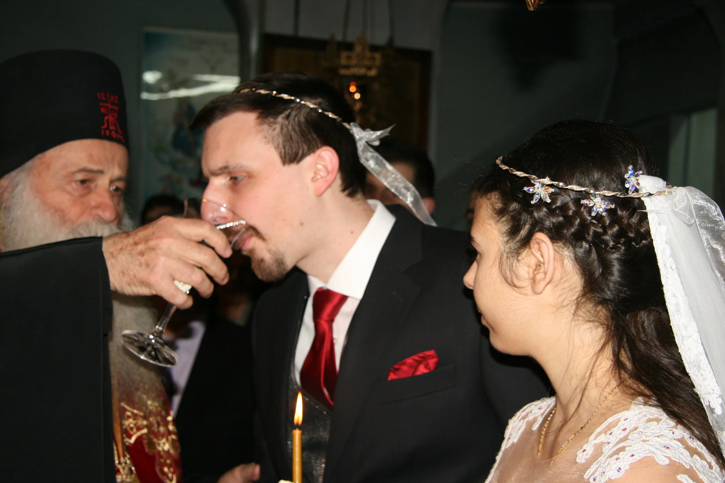 Gives wine to the groom & bride #1