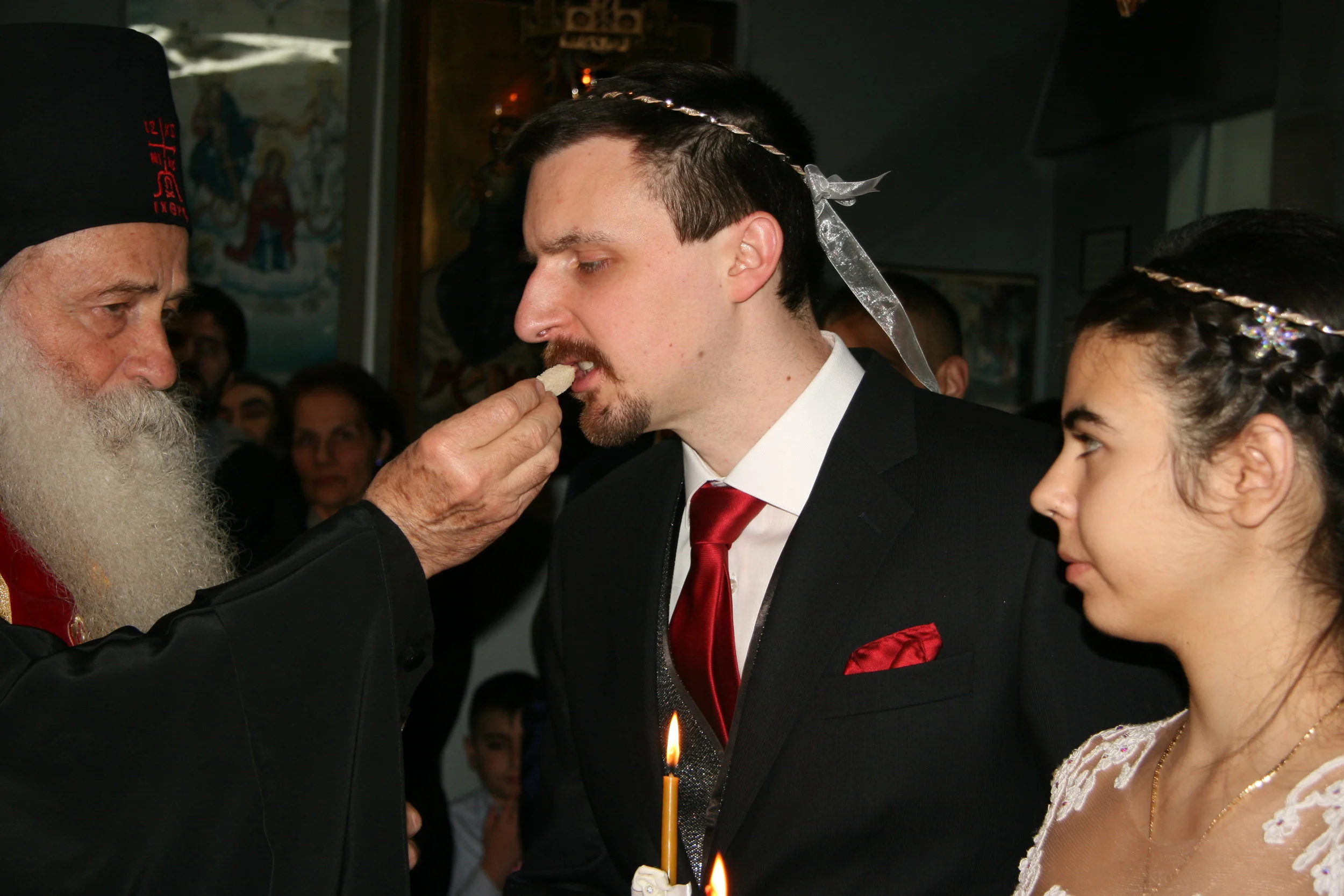 Gives bread to the groom & bride #1