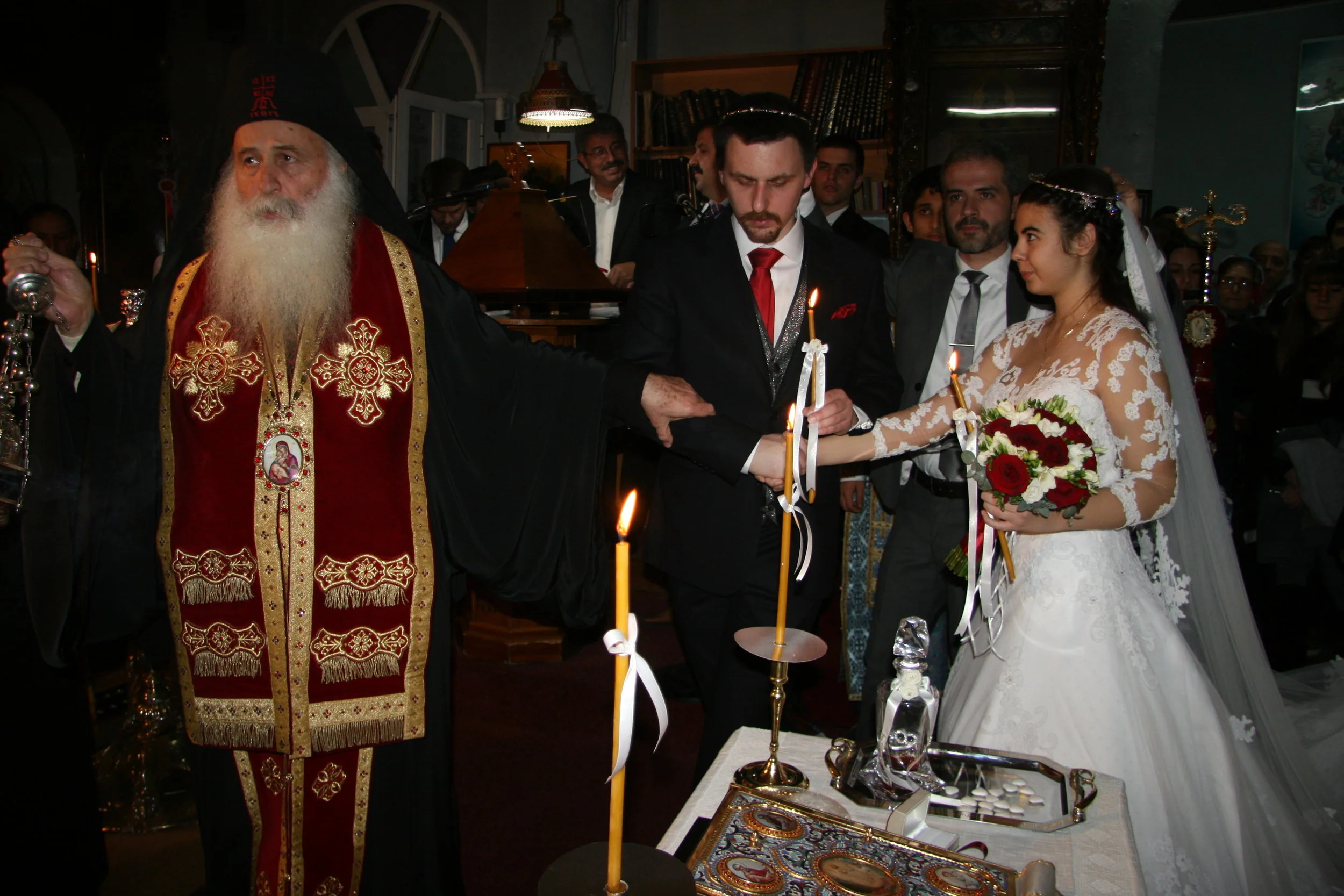 Bishop leads the couple around the table 3 times (Dance of Isaiah)