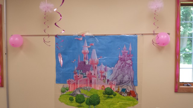 This castle decoration was so pretty! It stands about 5′ tall and made a great backdrop for pictures. It is in two pieces that don’t align perfectly, so you have to line them up yourself. I used double-sided tape, which worked well.